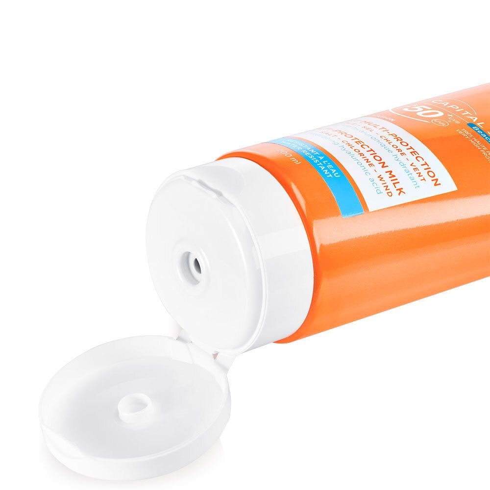 Primo piano del tappo bianco aperto di un tubo arancione. Apertura visibile per l'erogazione del prodotto.