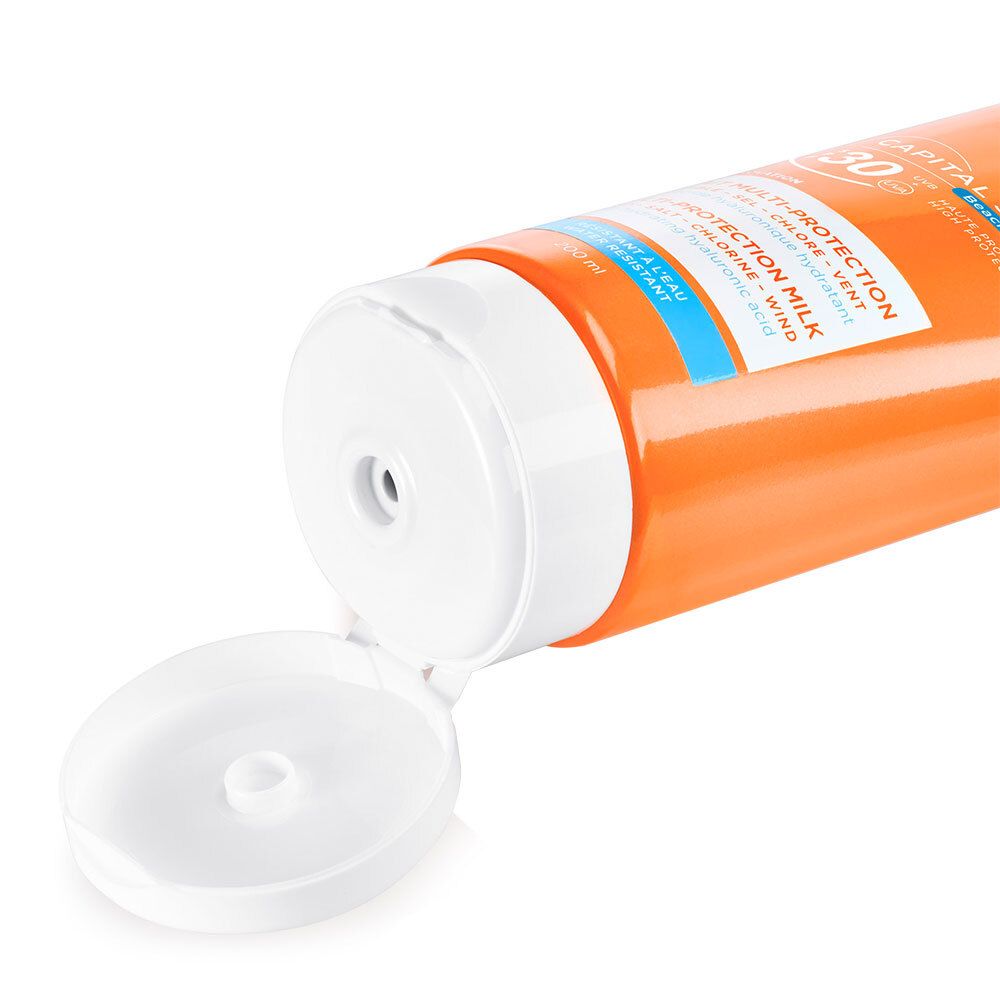 Primo piano del tappo aperto di un tubo arancione. Il tappo è bianco.