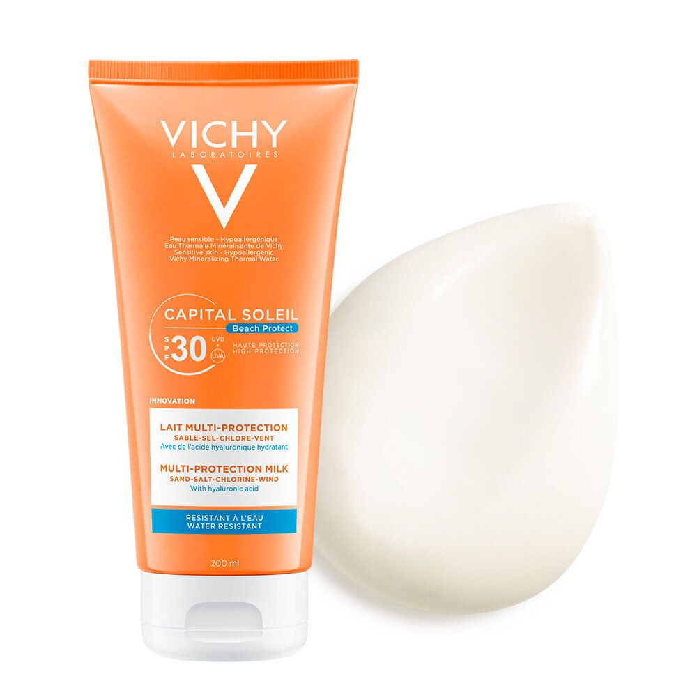 Tubo arancione con tappo bianco e sostanza cremosa accanto. Scritte: VICHY, CAPITAL SOLEIL, SPF 30, Latte Multi-Protezione.