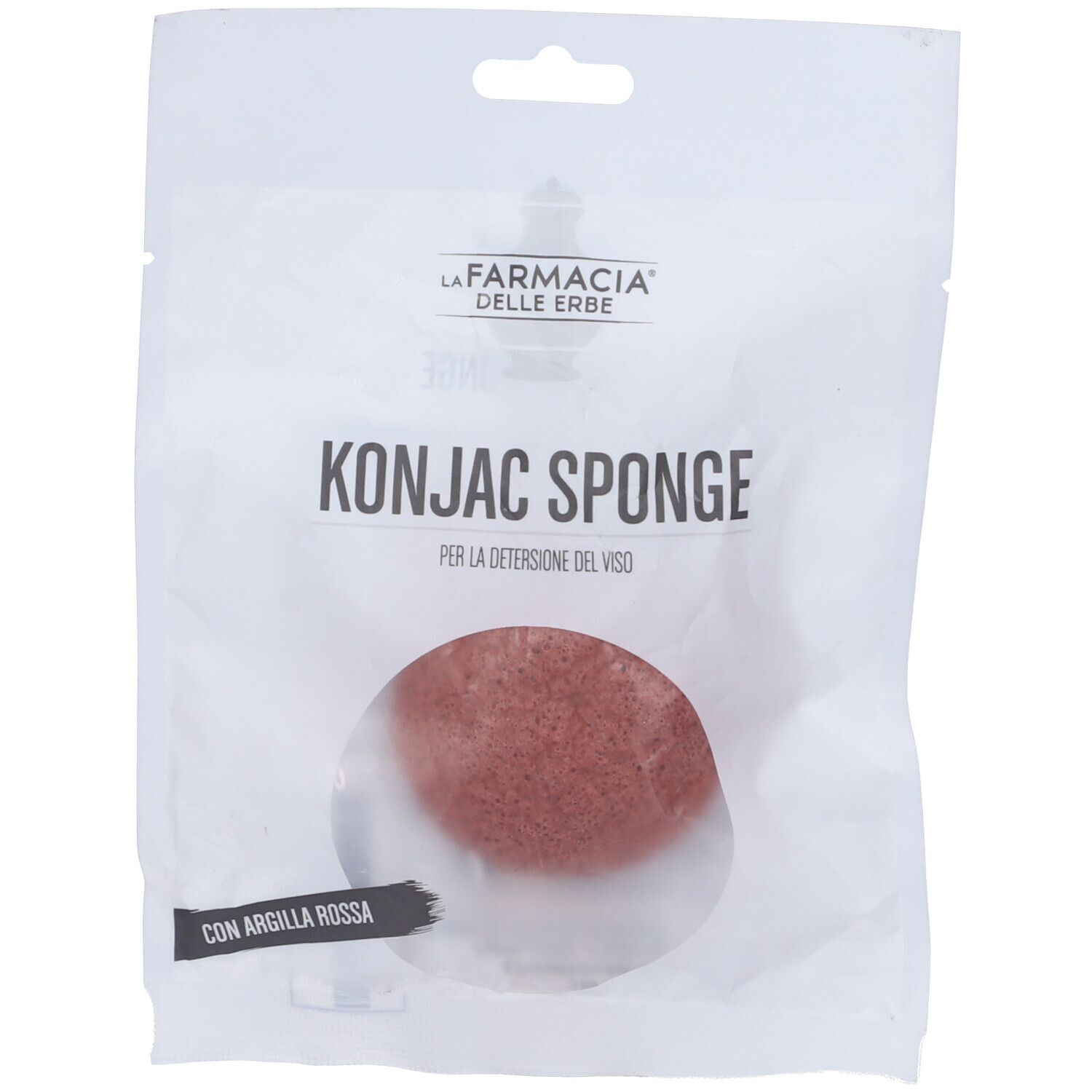 Spugna Konjac in confezione. Forma rotonda rossa, finestra trasparente. Testo: Konjac Sponge.