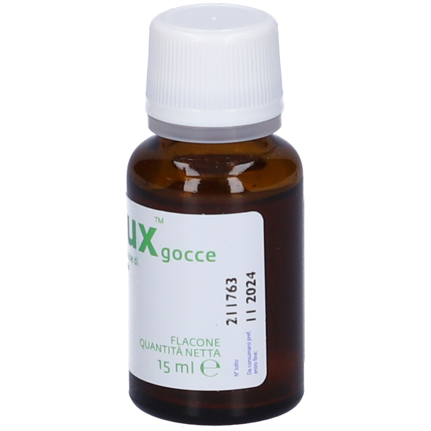 Flacone di vetro marrone con tappo bianco. Etichetta con informazioni sul prodotto. Marca: Oralux. 15 ml.