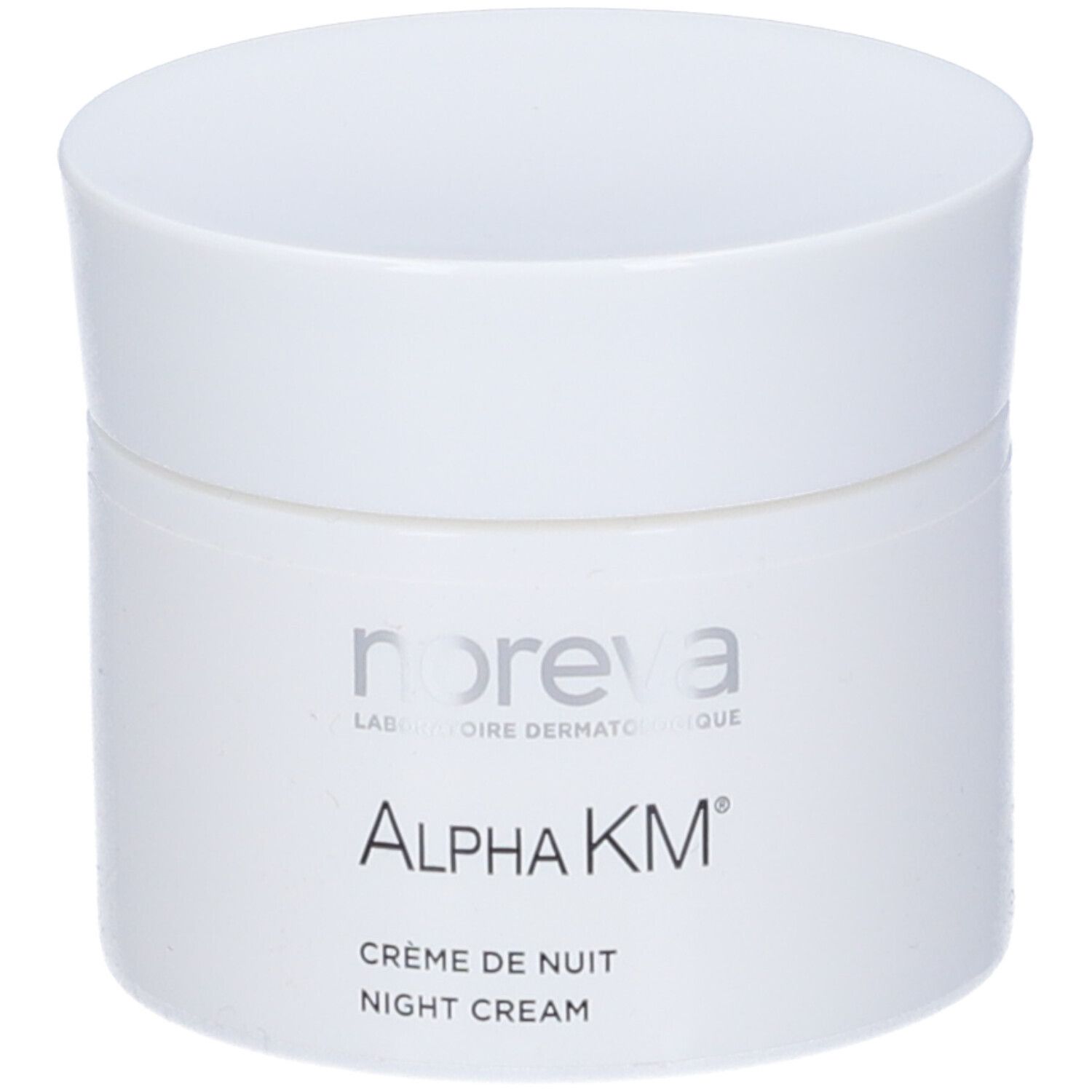 Vaso di crema bianco con coperchio. Scritta: Noreva, Alpha KM, Crème de Nuit, Night Cream.