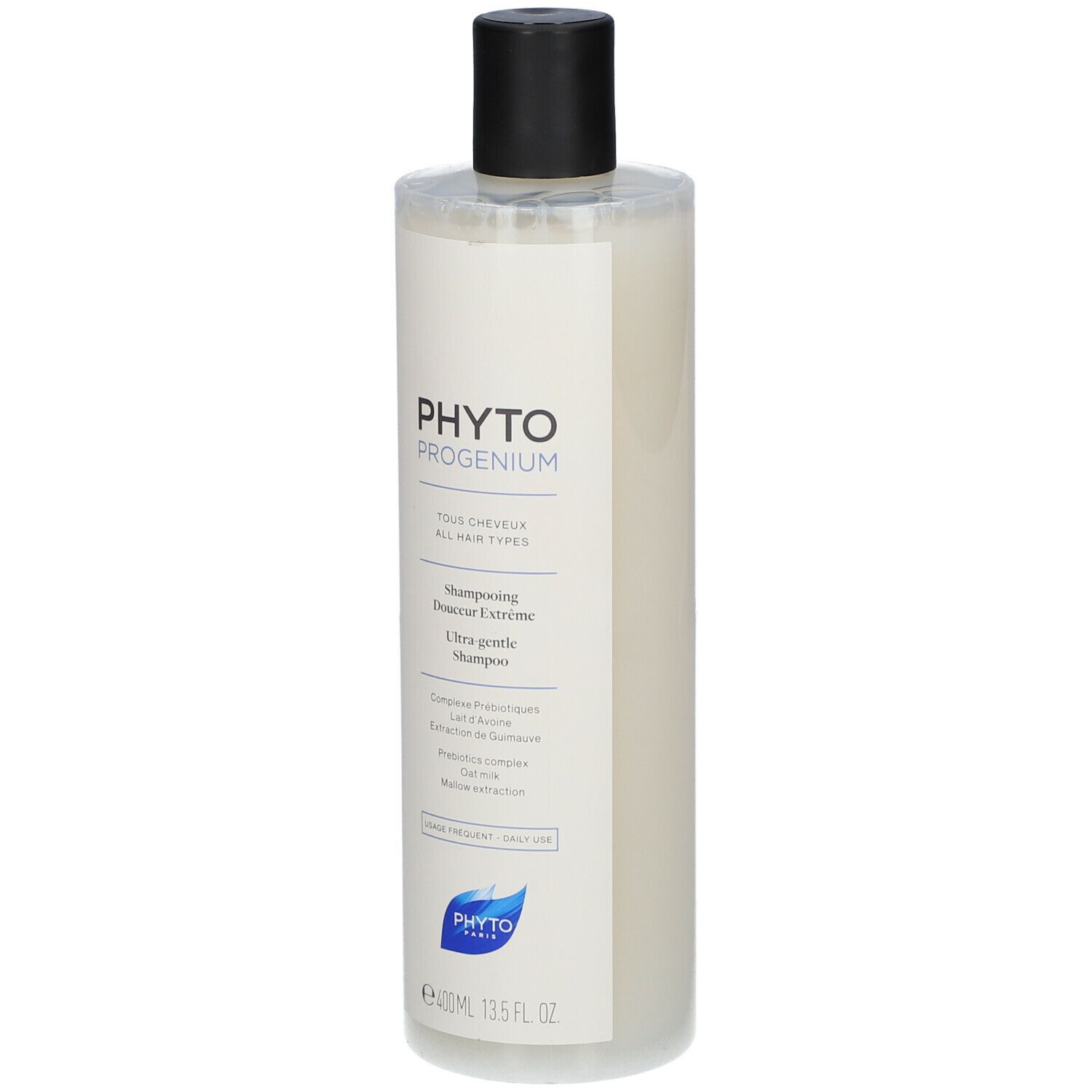 Flacone di shampoo. Etichetta bianca con testo nero: PHYTO PROGENIUM, Shampooing Douceur Extrême. Tappo nero. Logo blu.