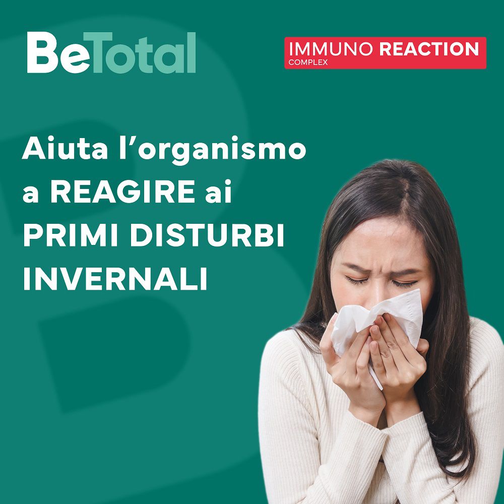 Donna con fazzoletto. Testo: Aiuta ai primi disturbi invernali. Be-Total Immuno Reaction. Sfondo verde.