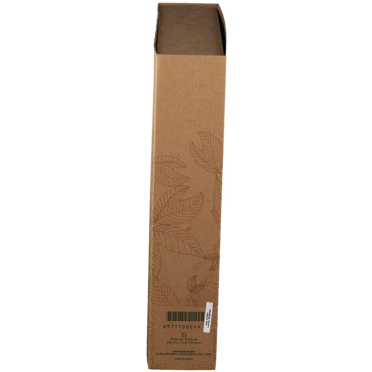 Confezione marrone allungata con motivo a foglie. Adesivo con codice a barre e informazioni sul prodotto.