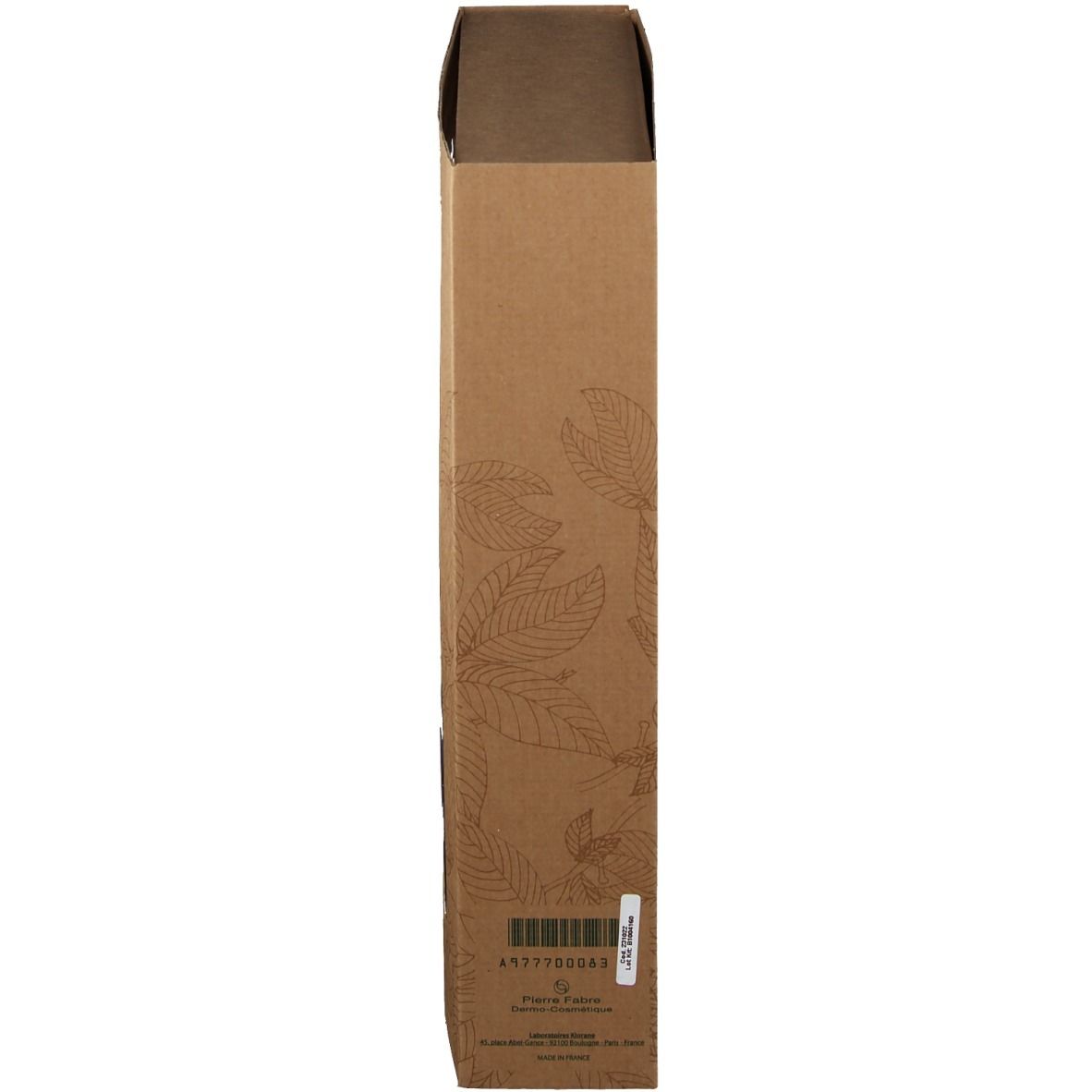 Vista laterale della confezione del prodotto. Scatola marrone con motivo a foglie. Codice a barre e informazioni.