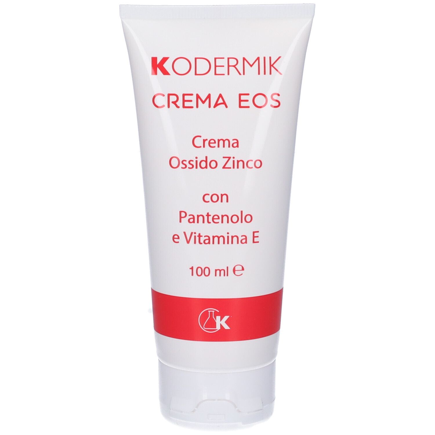 Tubo bianco con testo rosso. Testo: Kodermik Crema Eos, Crema Ossido Zinco, con Pantenolo e Vitamina E. 100 ml. Logo rosso.
