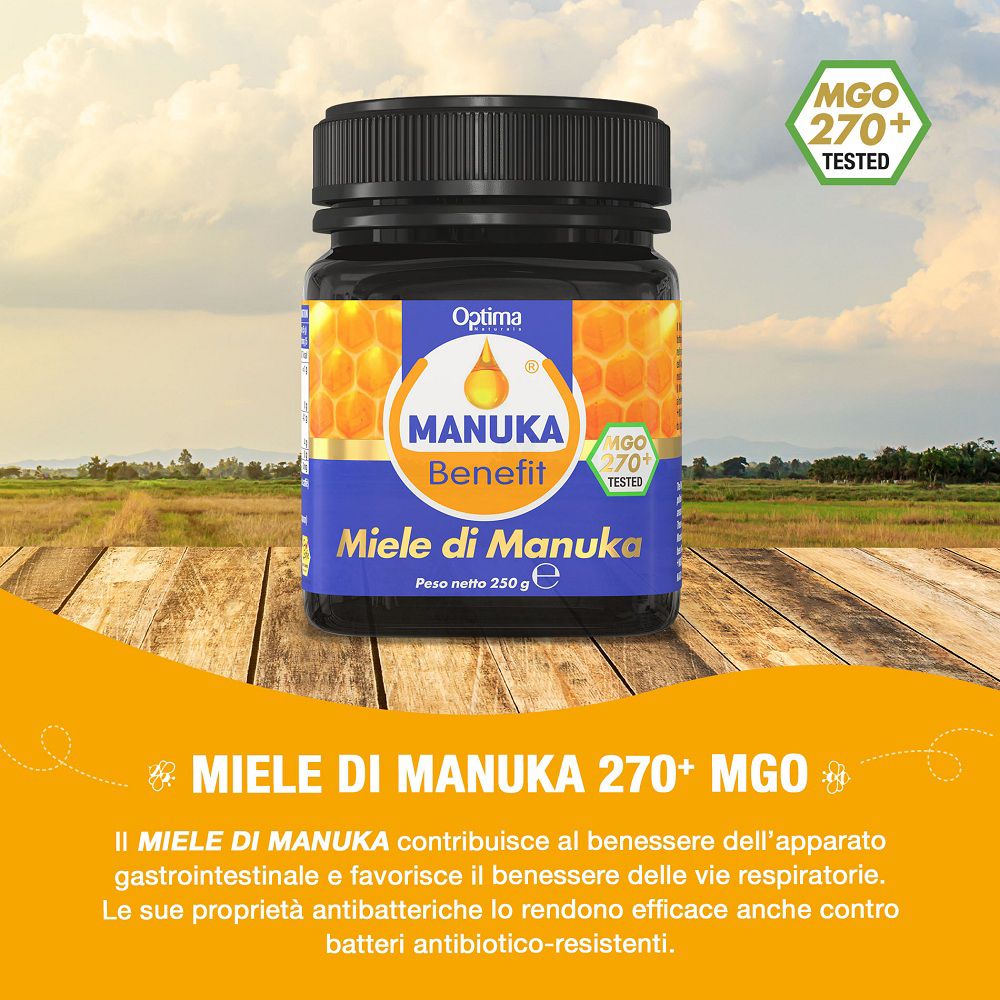 Vaso di miele di Manuka su un tavolo di legno all'aperto.