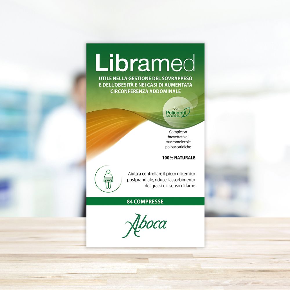 Confezione Libramed. Design verde e bianco. Testo: '84 compresse'. Logo Aboca. Sfondo sfocato.