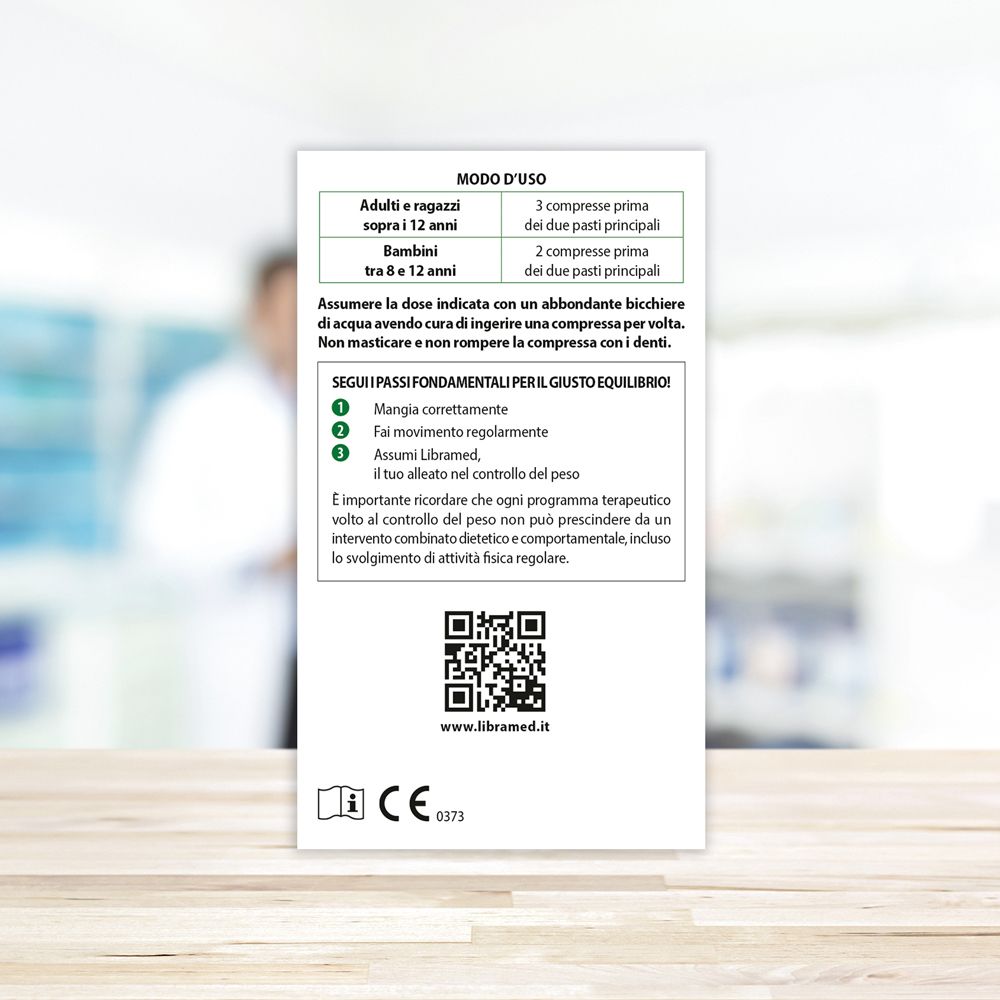 Flacone di vetro marrone con etichetta Libramed. Tappo dorato. Compresse visibili.