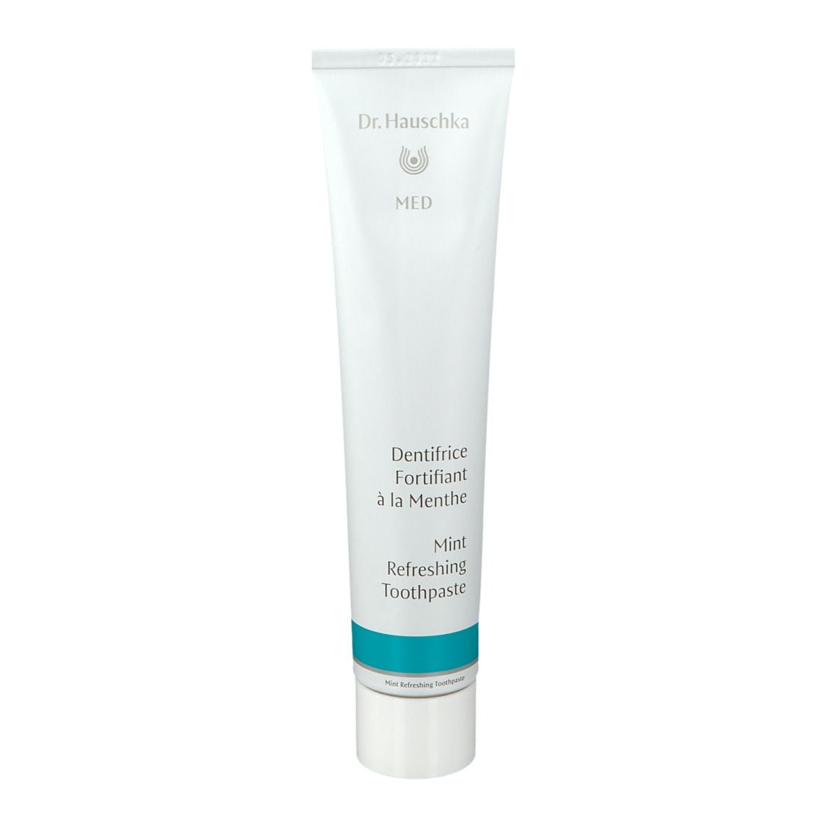 Tubo bianco con fascia blu. Scritta: Dr. Hauschka MED, Mint Refreshing Toothpaste, Dentifrice Fortifiant à la Menthe.