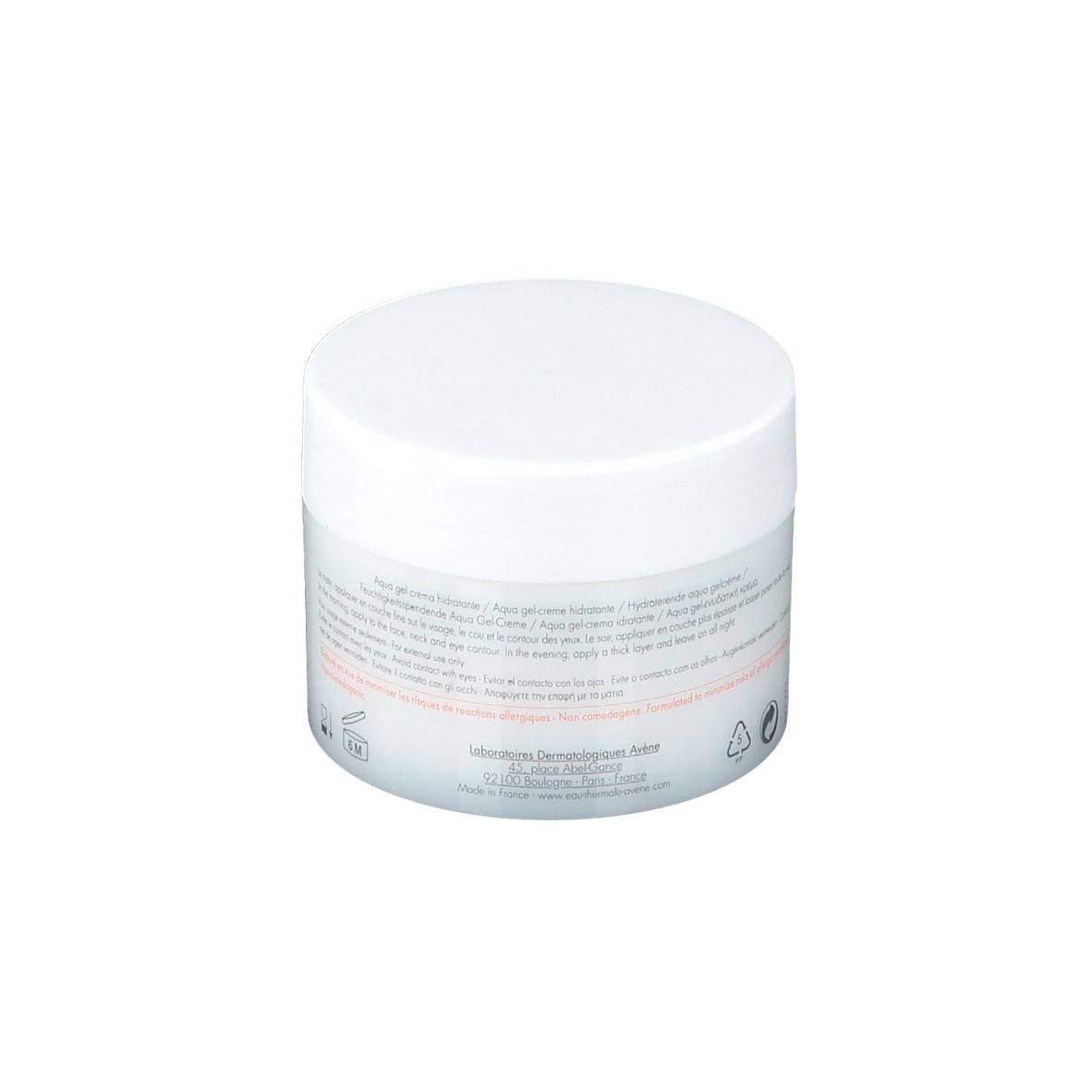 Vasetto bianco con coperchio. Testo e simboli sull'etichetta.