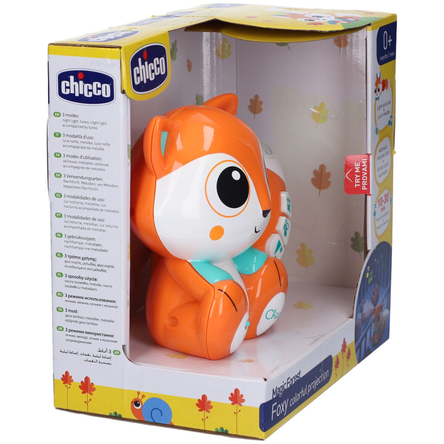 Proiettore Chicco Foxy nella confezione. Design a testa di volpe arancione e bianca. Caratteristiche del prodotto sulla confezione.