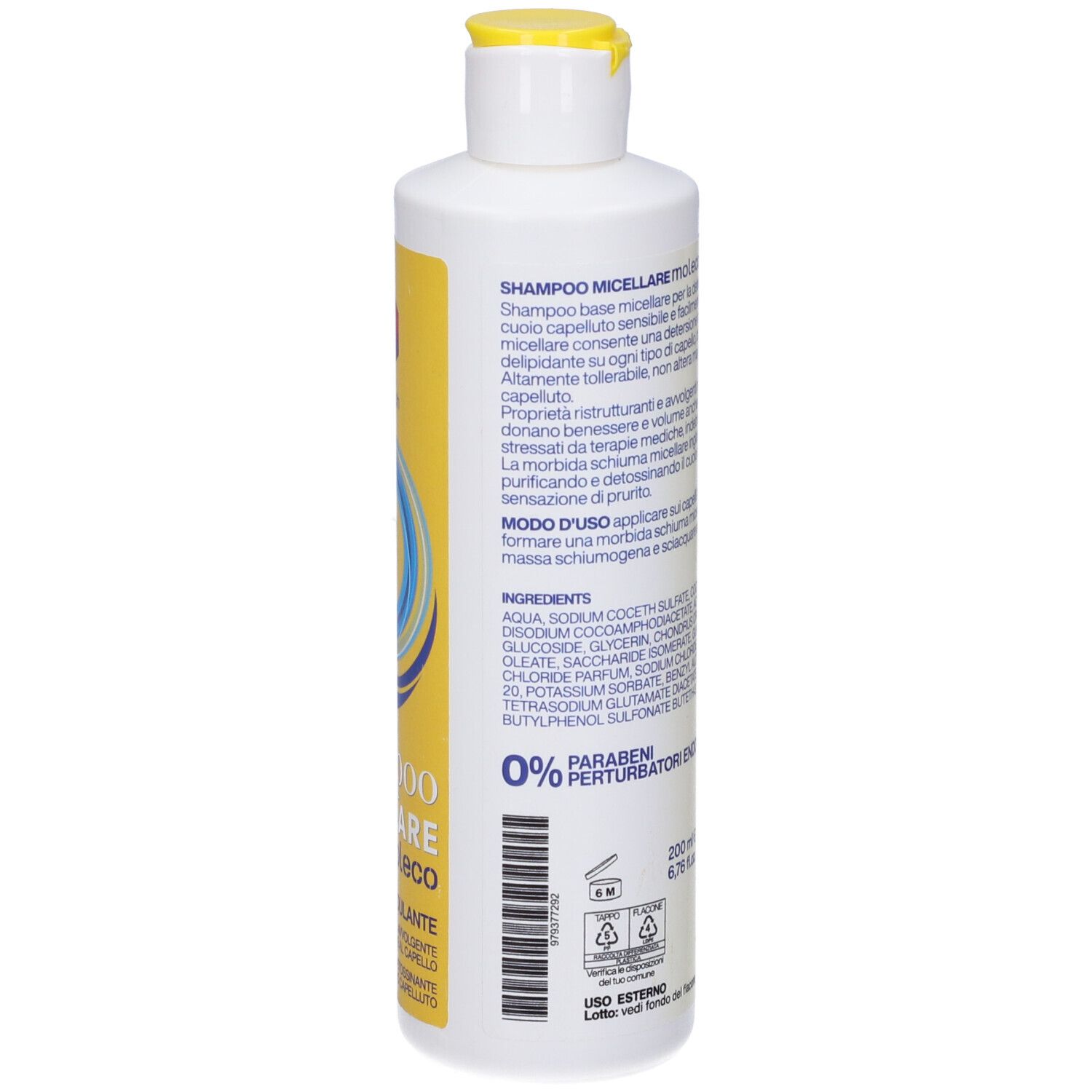 Retro del flacone giallo. Contiene testo con ingredienti e informazioni sul prodotto.