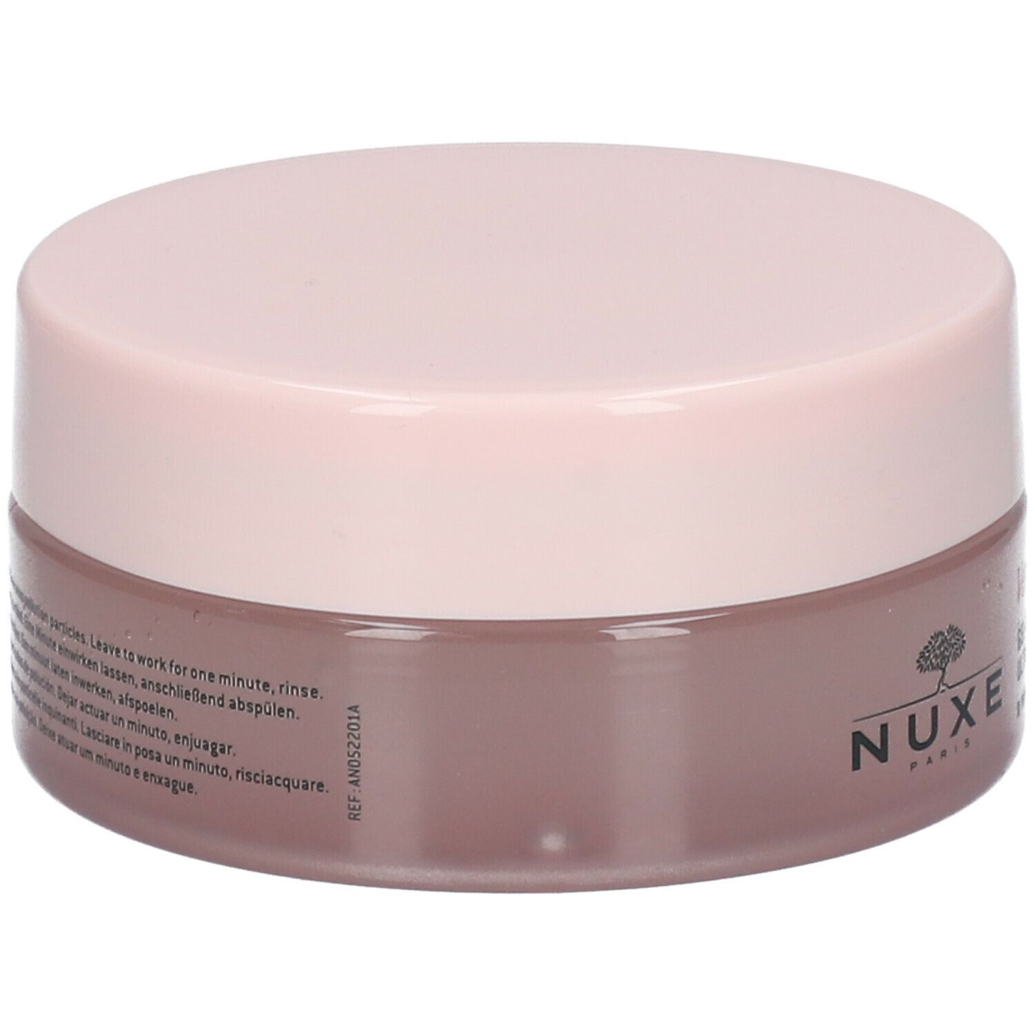 Barattolo rotondo rosa e marrone. Scritta: Nuxe Paris. Testo multilingue sul retro.