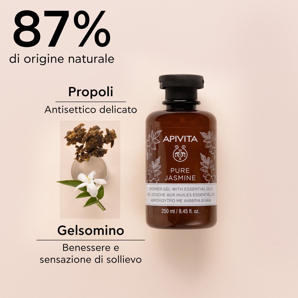 Flacone marrone con tappo nero. Scritta: APIVITA Pure Jasmine Gel doccia. 87% di origine naturale. Fiori di gelsomino.