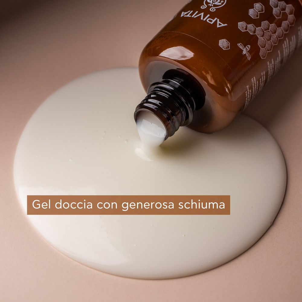 Flacone marrone con tappo nero. Il gel fuoriesce. Testo: Gel doccia con schiuma generosa.