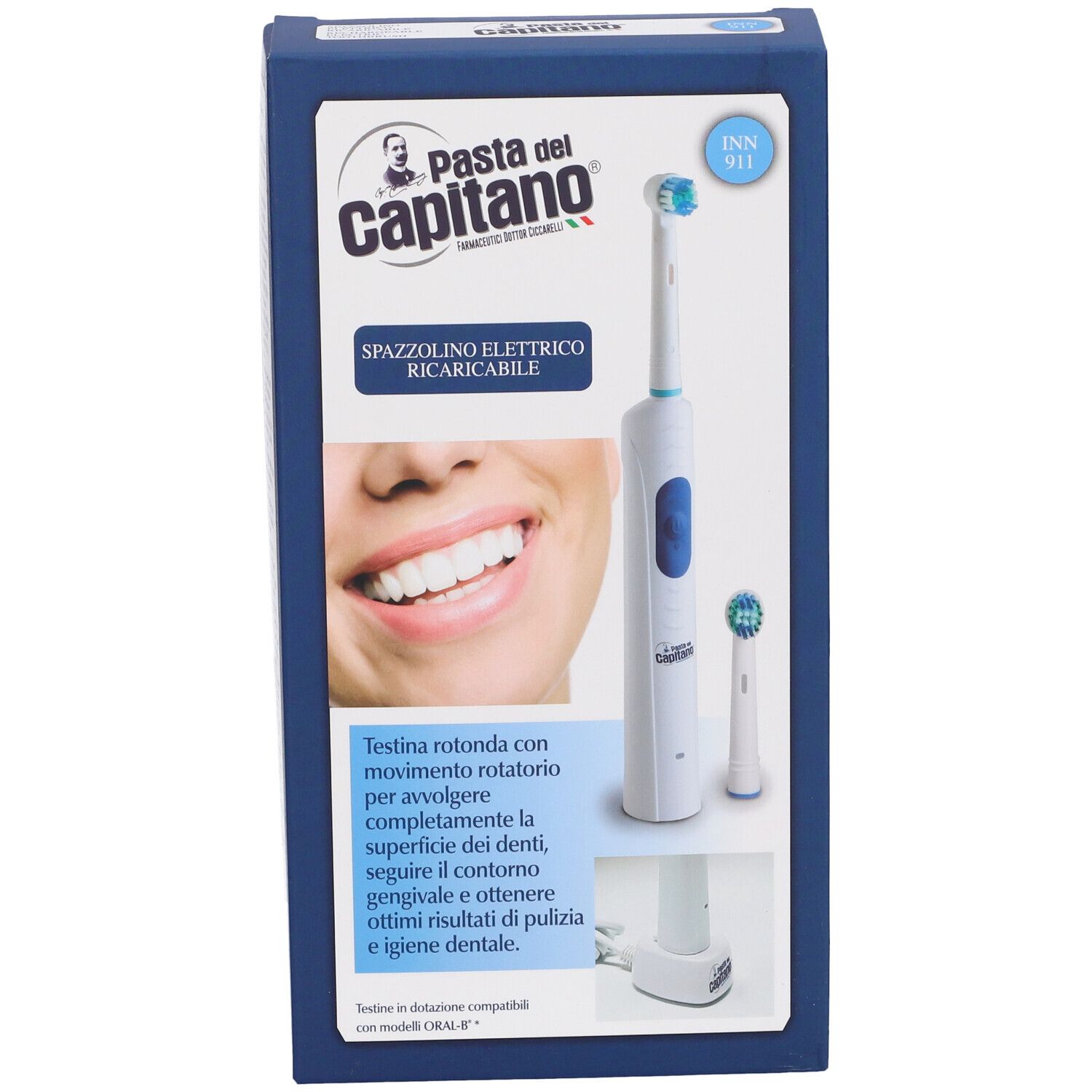 Spazzolino elettrico in confezione. Spazzolino bianco e blu con testina di ricambio e base di ricarica. Marchio: Pasta del Capitano.