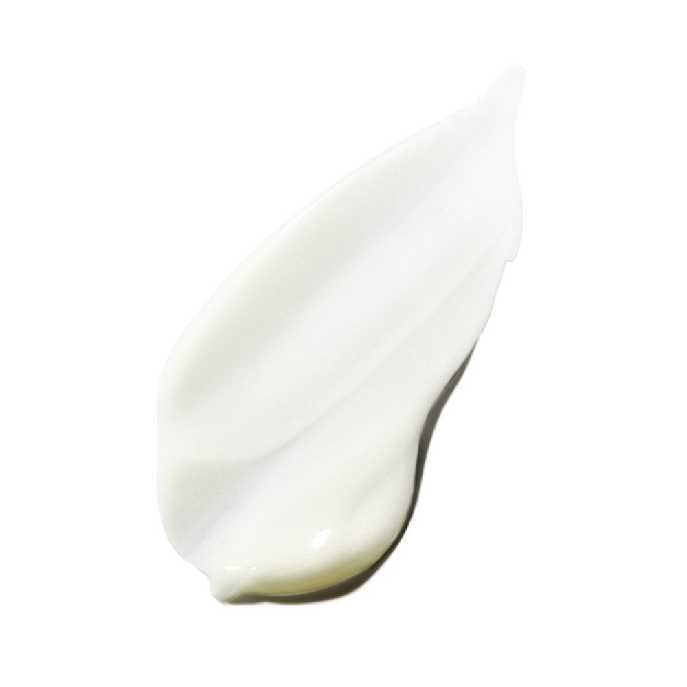 Prodotto siero bianco spalmato su una superficie bianca. Texture lucida.