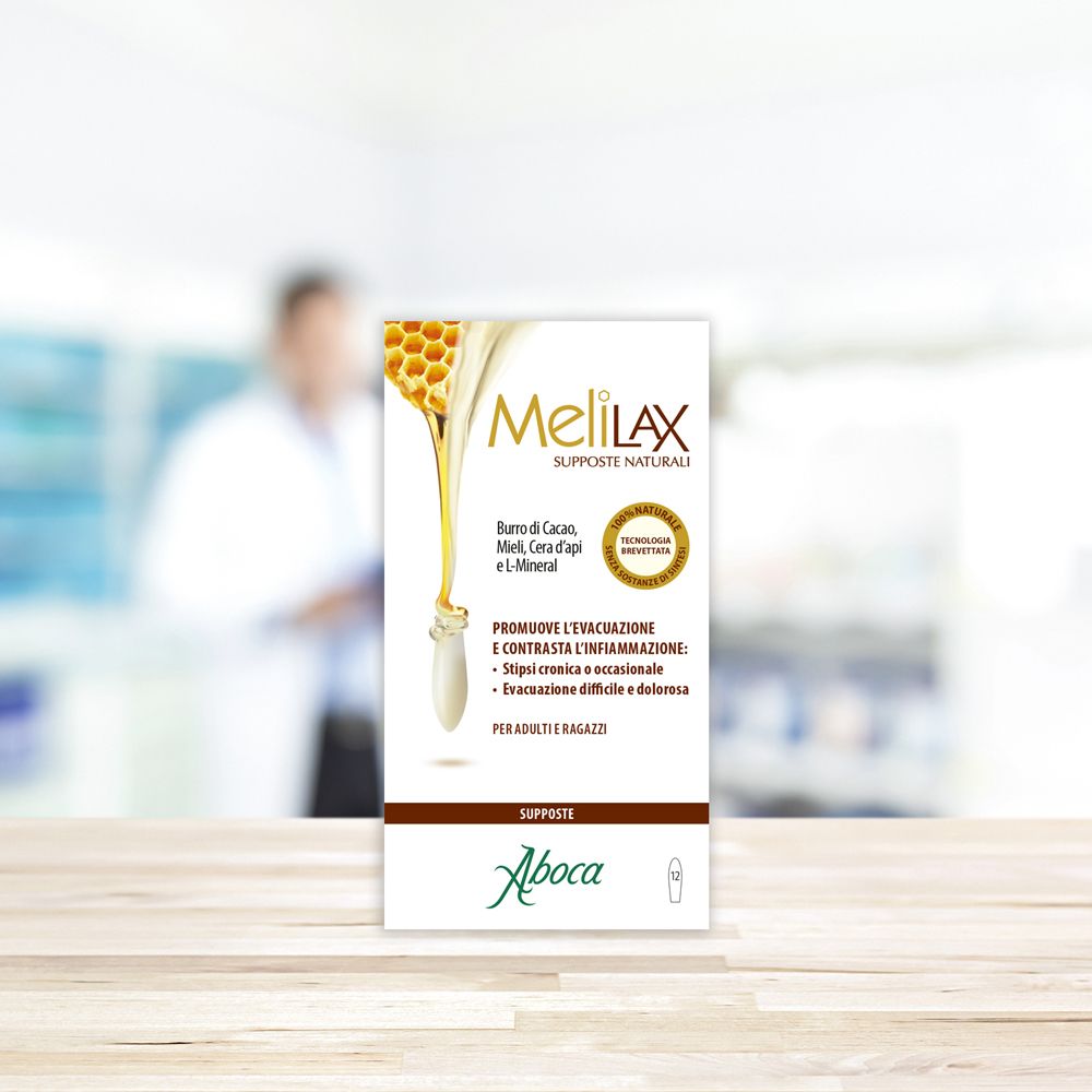 Confezione di Melilax Supposte. Logo con goccia di miele e favo. Scritta Supposte Naturali. Logo Aboca.