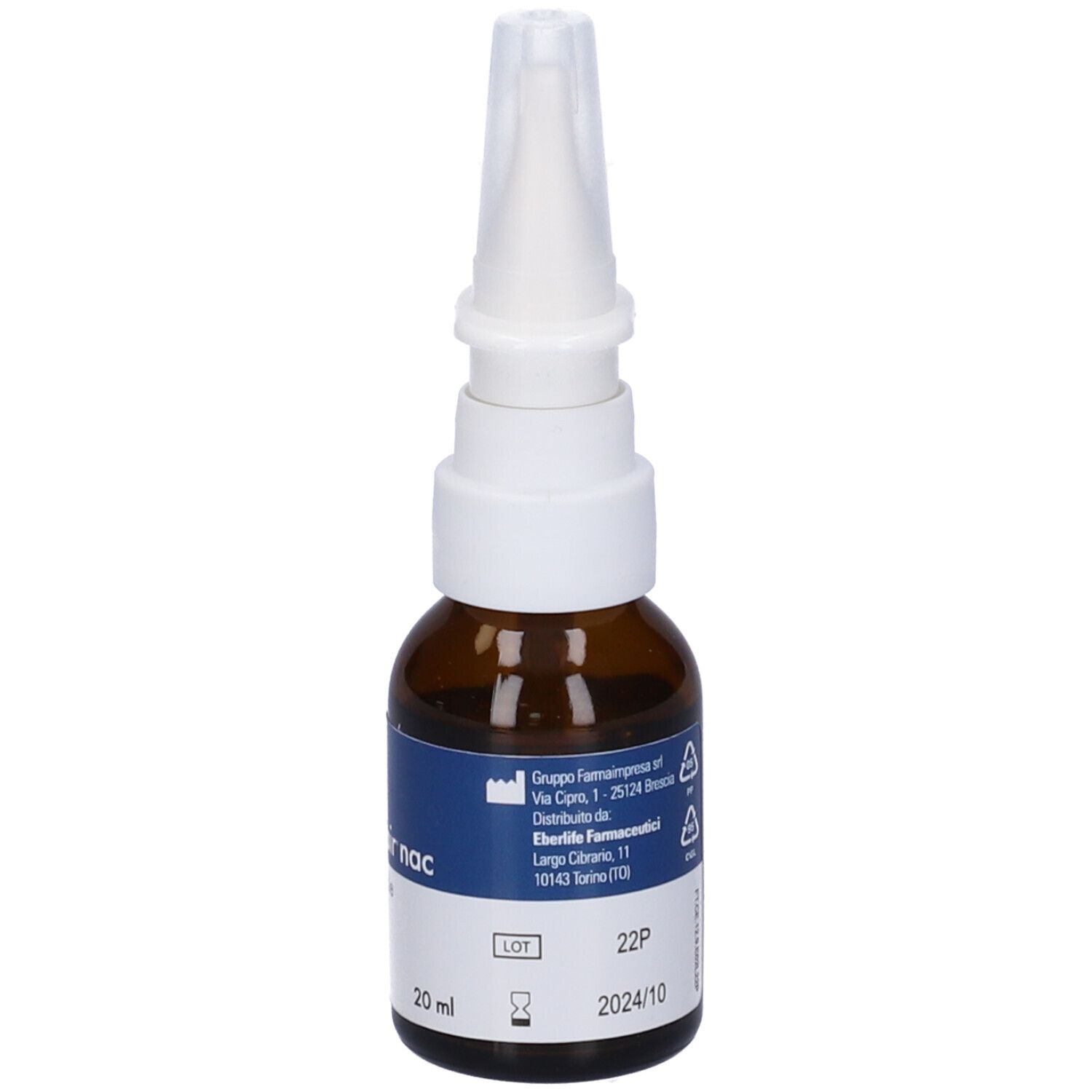 Flacone spray nasale, vetro marrone, erogatore bianco. Etichetta blu con indirizzo del produttore e numero di lotto. 20 ml.