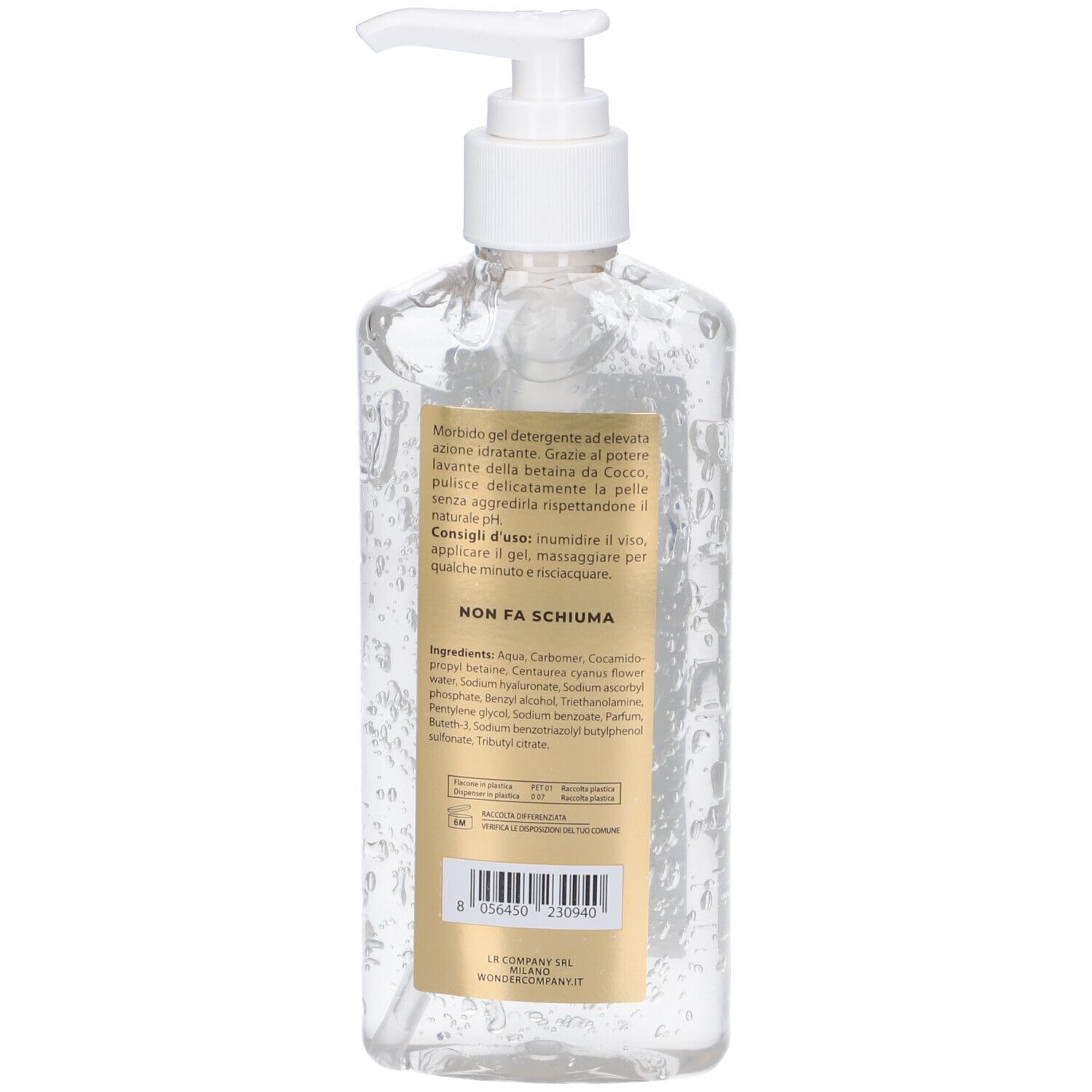 Retro del flacone trasparente con dosatore bianco. Etichetta dorata con testo e codice a barre.