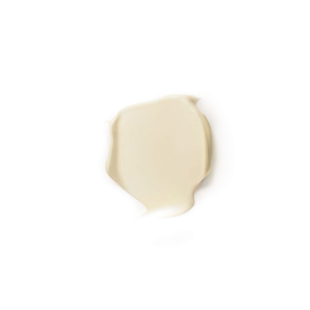 Macchia di crema, giallo chiaro, su sfondo bianco.