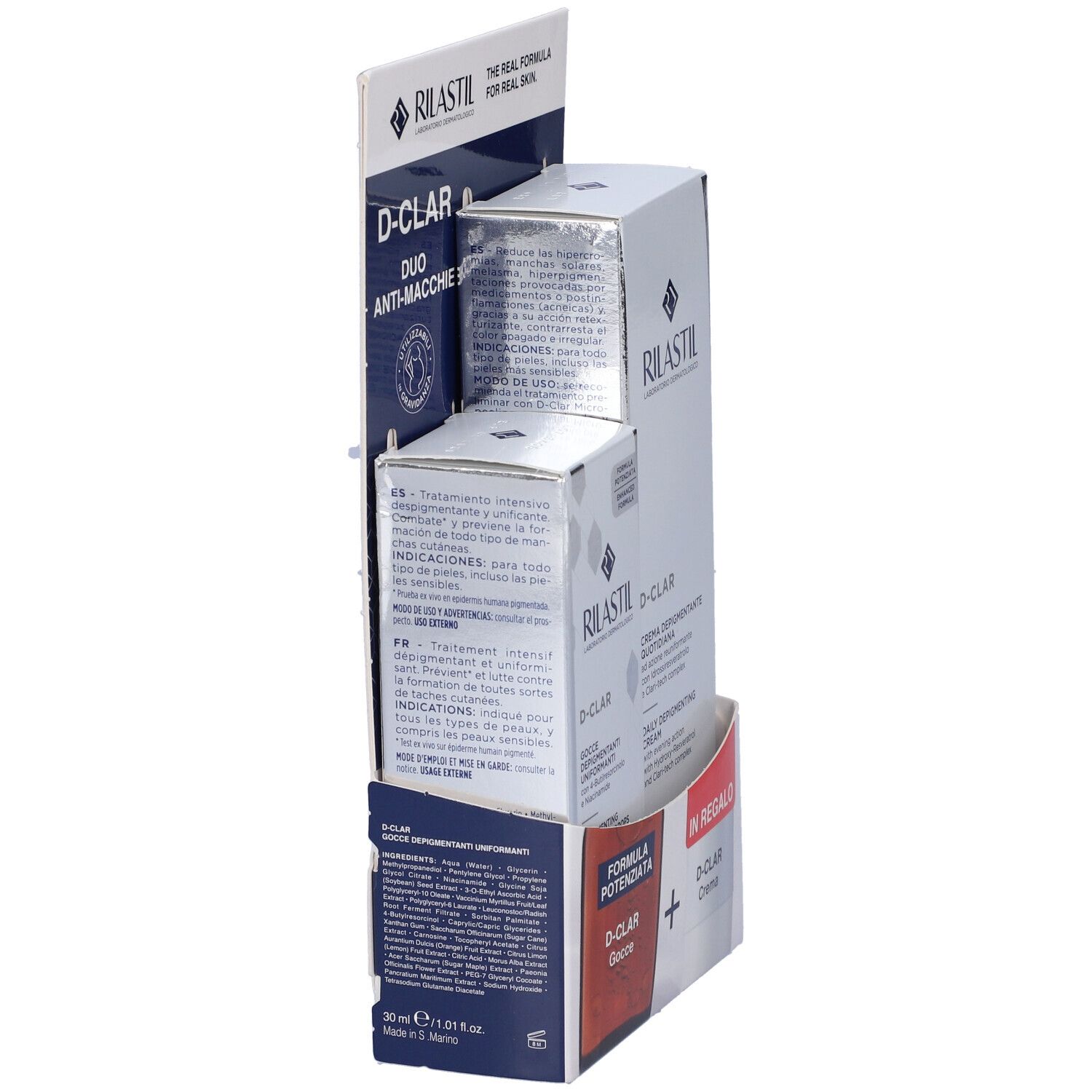 Vista laterale della confezione. Contiene D-Clar Gocce e Crema. Testo multilingue.
