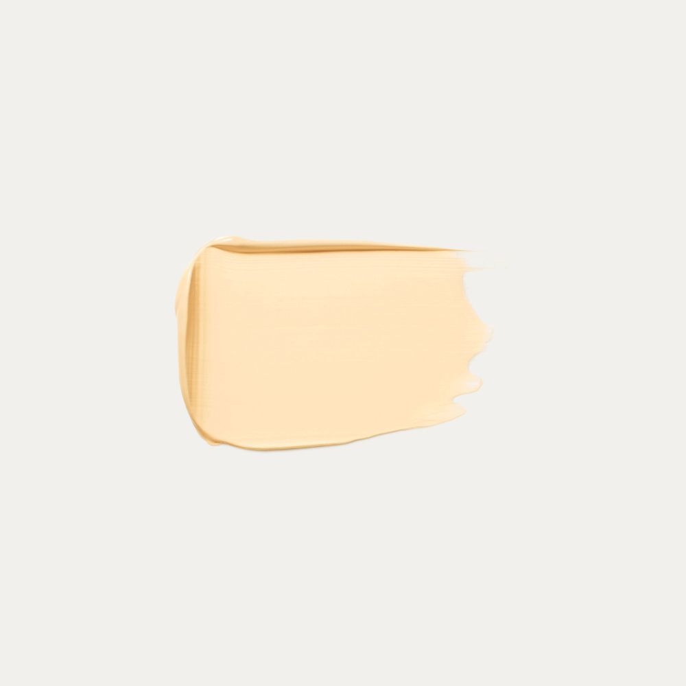 Fondotinta spalmato, tonalità beige chiaro.