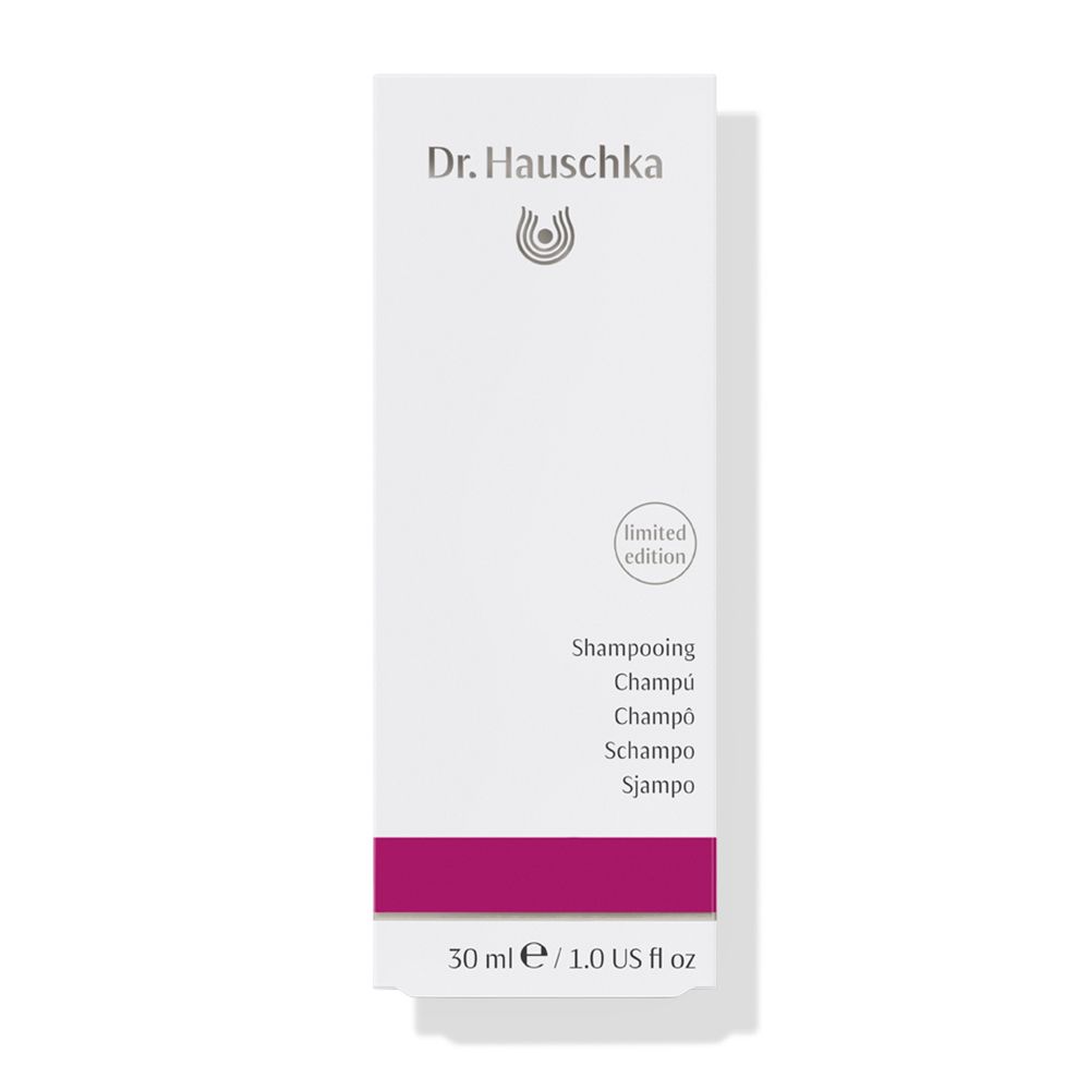 Scatola bianca con fascia viola. Scritta: Dr. Hauschka, Shampoo, edizione limitata. 30 ml.
