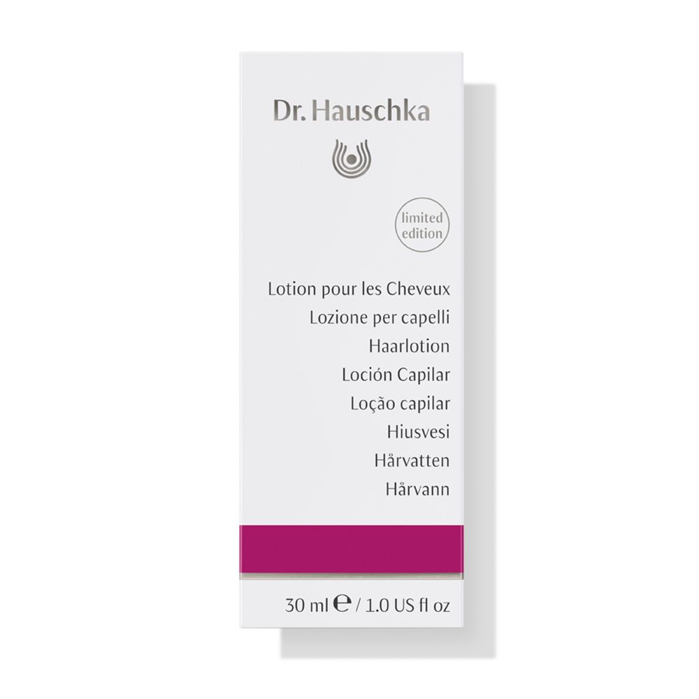 Confezione bianca con nome del prodotto in più lingue. Contiene 'Lozione per capelli'.