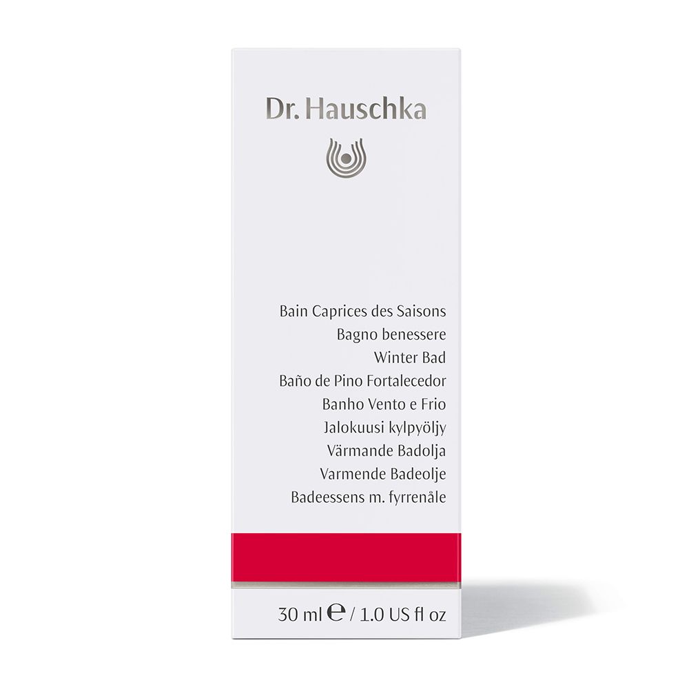 Confezione bianca con logo Dr. Hauschka. Testo: Bain Caprices des Saisons, Winter Bad, 30 ml / 1.0 US fl oz. Striscia rossa.