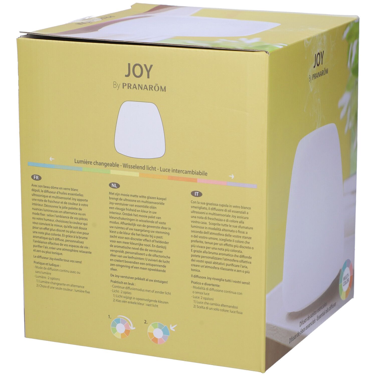 Scatola con diffusore bianco. Scritta: JOY by Pranarôm. Testo multilingue. Cerchio multicolore.