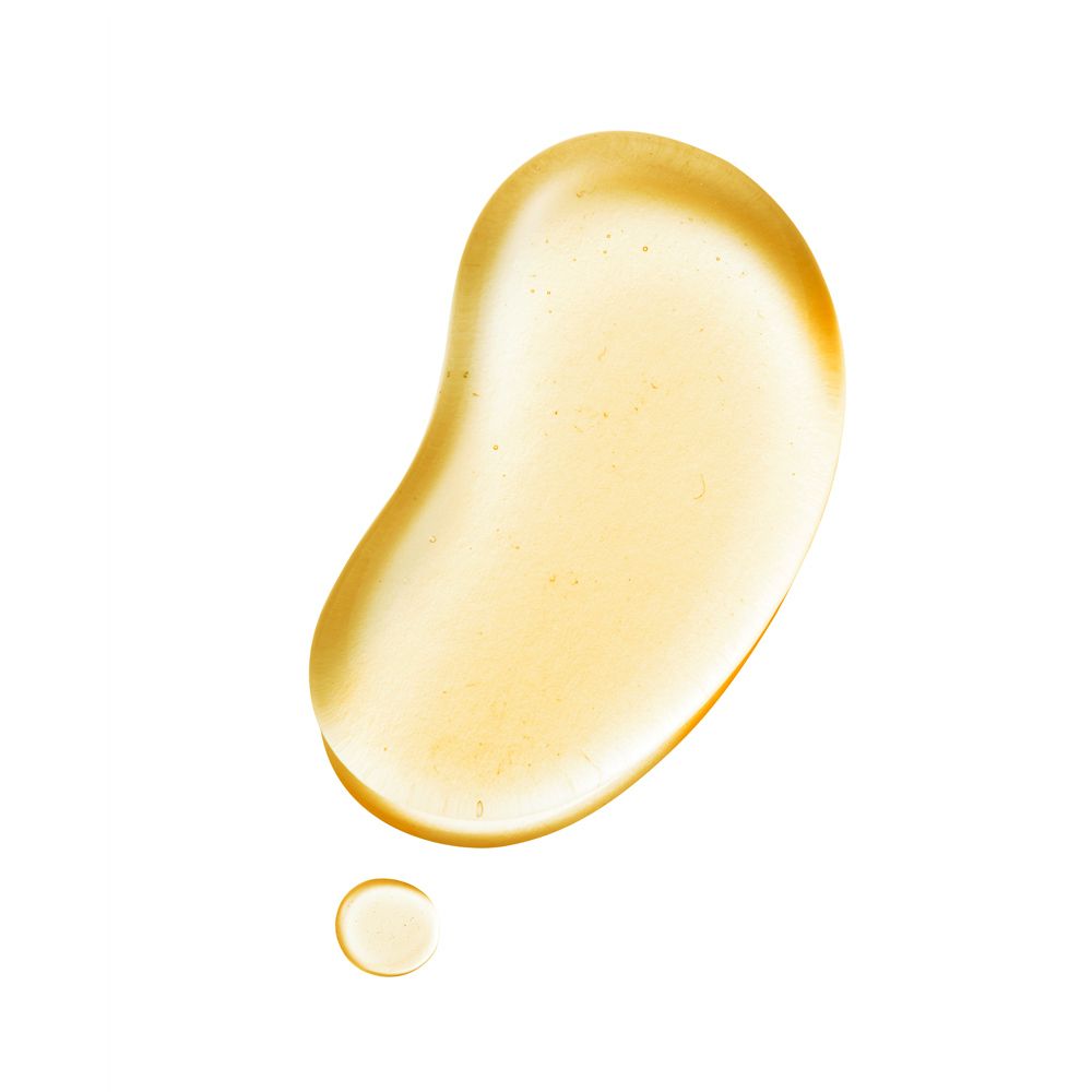 Macchia gialla a forma di goccia, con una goccia più piccola. Su sfondo bianco.