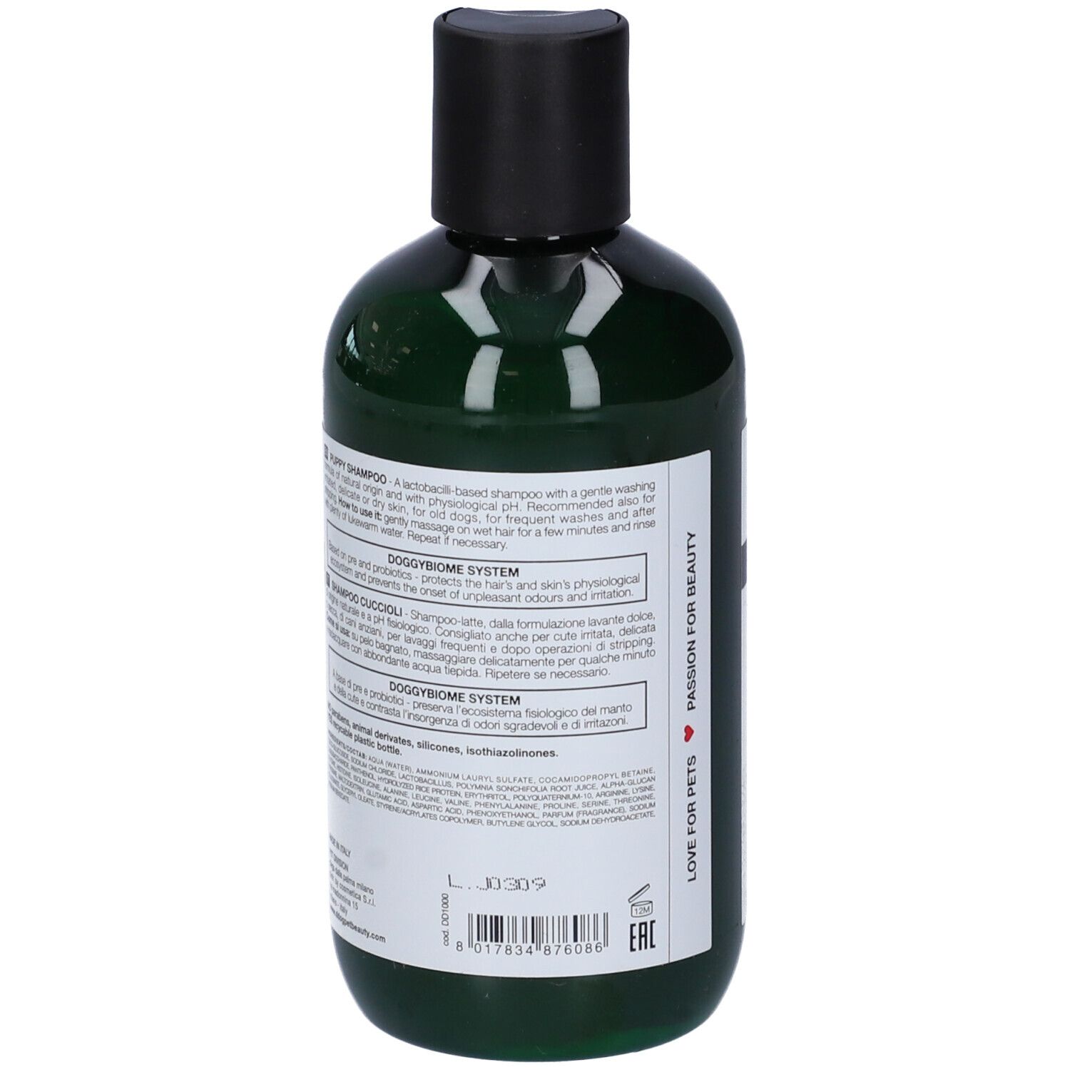 Flacone verde, vista posteriore. Testo sull'etichetta. Ingredienti e istruzioni. "DOGGYBIOME SYSTEM".