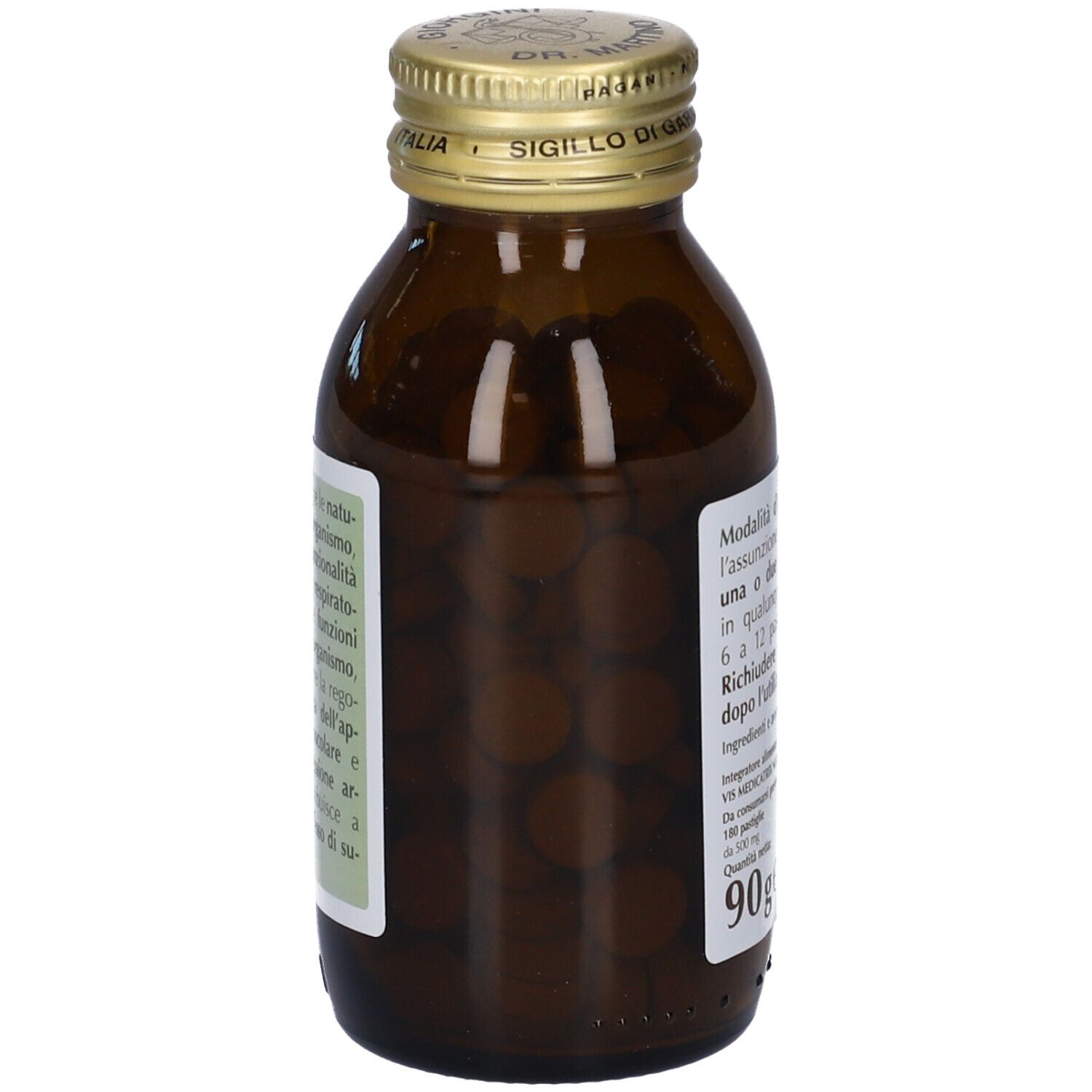 Bottiglia di vetro marrone con tappo dorato. Bottiglia piena di compresse marroni. Etichetta con informazioni prodotto. 90g.