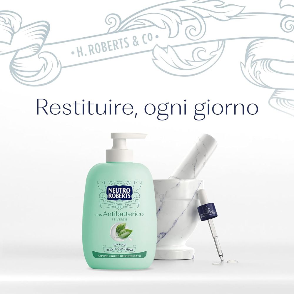 Presentazione del prodotto. Flacone di sapone verde, mortaio, pipetta. Testo: Neutro Roberts, Antibatterico.