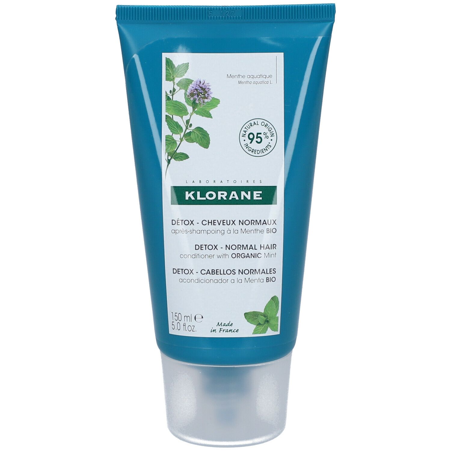 Tubo turchese Klorane. Illustrazione menta e testo. Contiene il 95% di ingredienti di origine naturale.