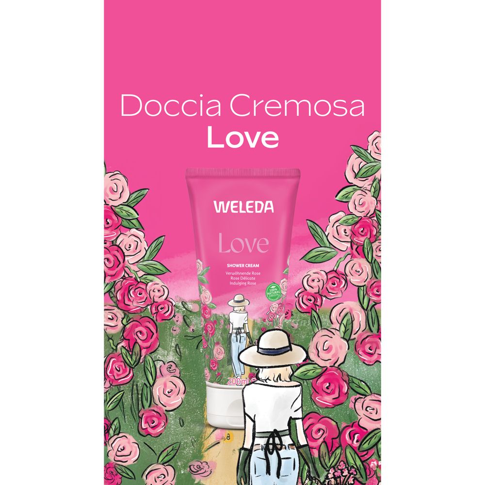 Pubblicità per crema doccia. Sfondo rosa con rose. Tubo del prodotto con scritta "Love" e marchio WELEDA.