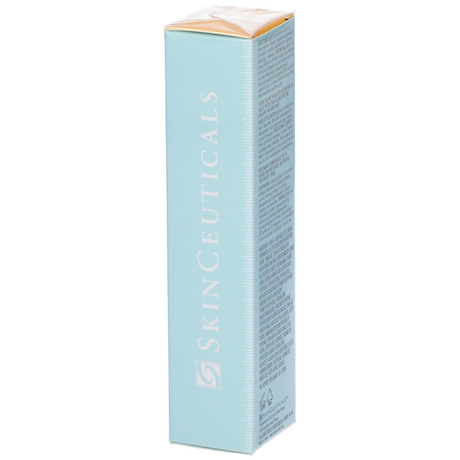 Confezione di cartone con testo. Scritta: Oil Shield UV Defense Sunscreen, SPF 50. Sfondo azzurro. Testo multilingue.