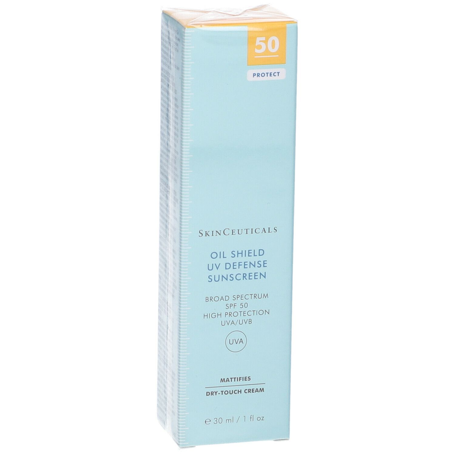 Confezione di cartone con protezione solare. Scritta: Oil Shield UV Defense Sunscreen, SPF 50. Sfondo azzurro.