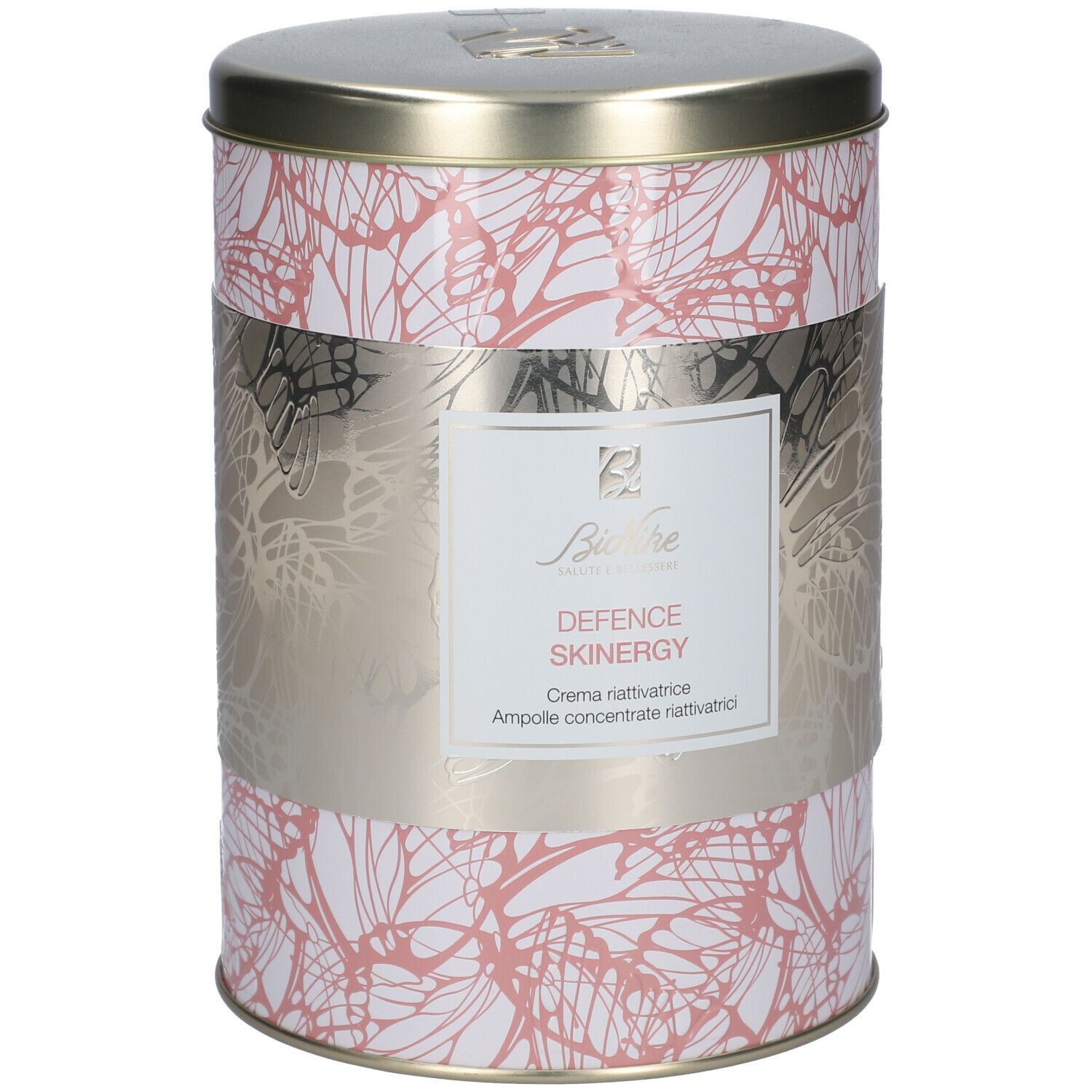 Barattolo cilindrico con motivo floreale e fascia argentata. La fascia riporta 'DEFENCE SKINERGY' e 'Crema riattivatrice'.