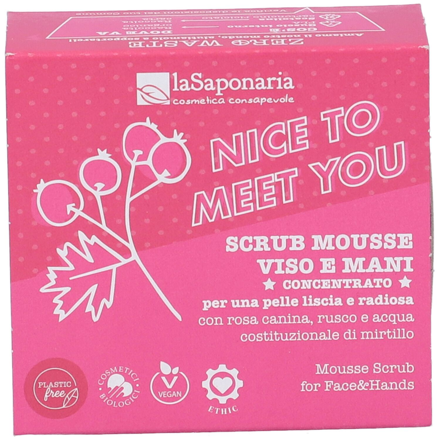 Confezione rosa con informazioni prodotto. Scritta: "NICE TO MEET YOU", "SCRUB MOUSSE VISO E MANI". Loghi: "Plastic Free", "Cosmetici Biologici", "Vegan".