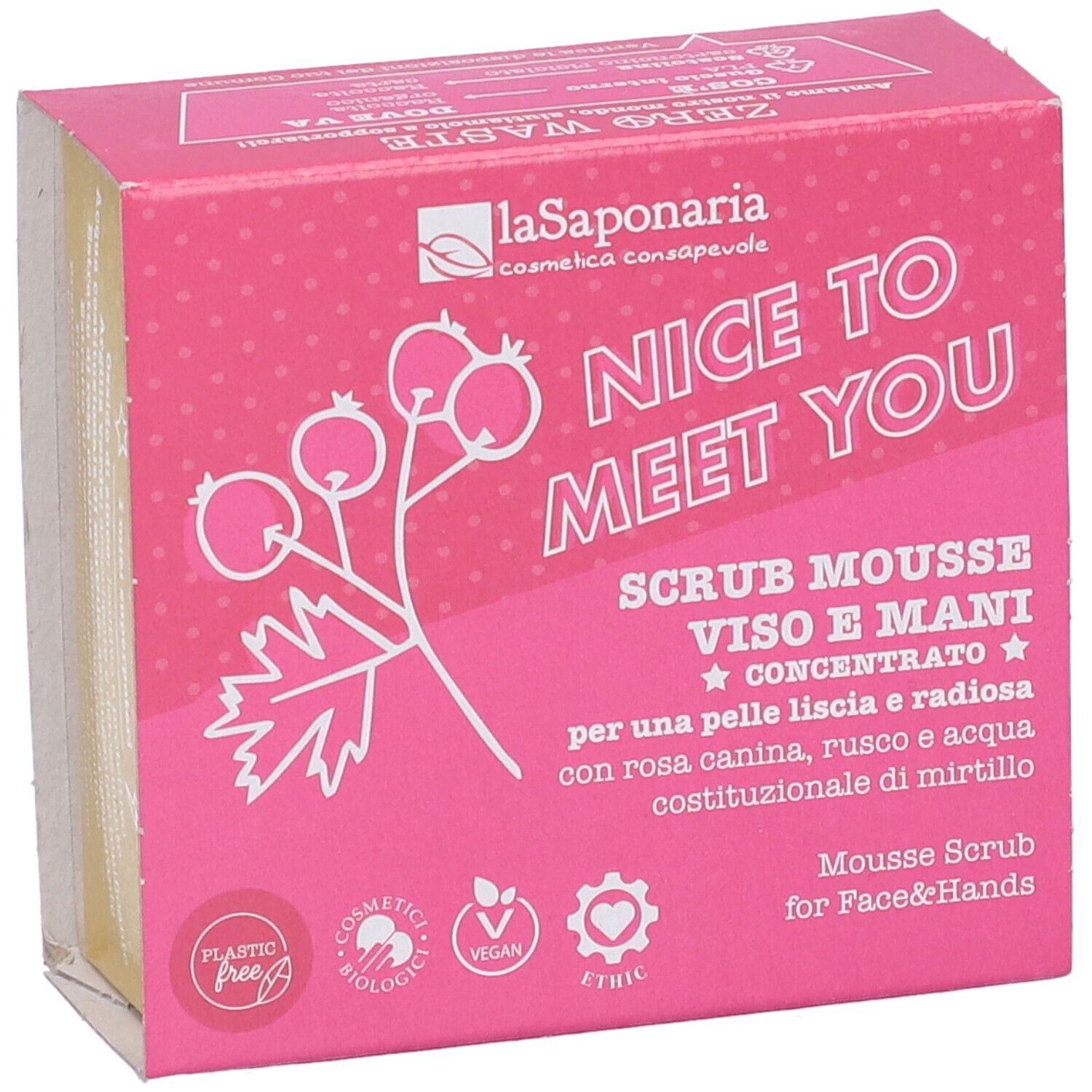 Confezione rosa con informazioni prodotto. Scritta: "NICE TO MEET YOU", "SCRUB MOUSSE VISO E MANI". Loghi: "Plastic Free", "Cosmetici Biologici", "Vegan".