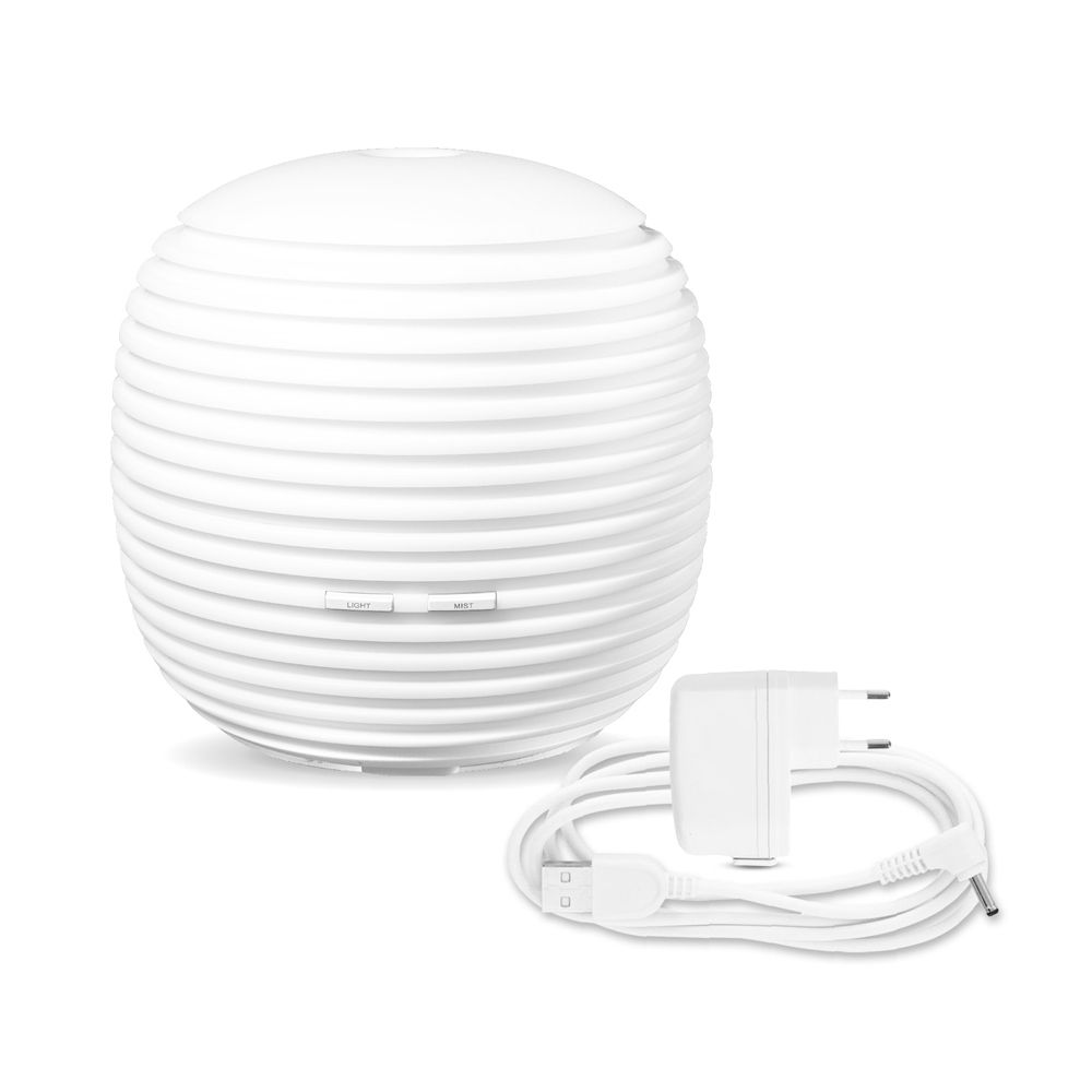 Diffusore bianco con superficie scanalata, alimentatore e cavo. Scritto: Pumilene Home Rigo Diffusore Ultrasuoni.