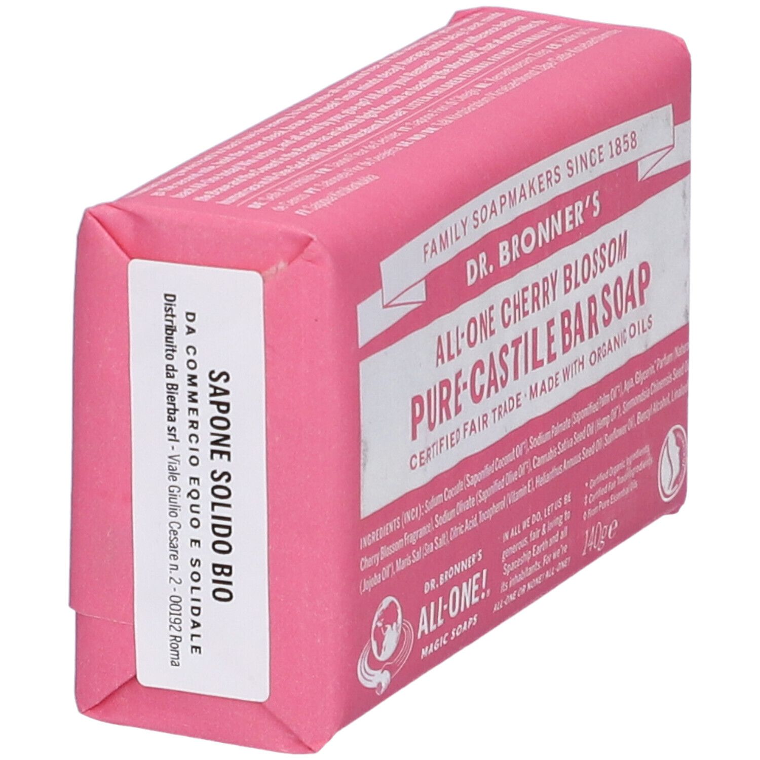 Sapone rosa confezionato. Scritta: Sapone Solido Bio. Etichetta con indirizzo. Nome del prodotto non visibile.