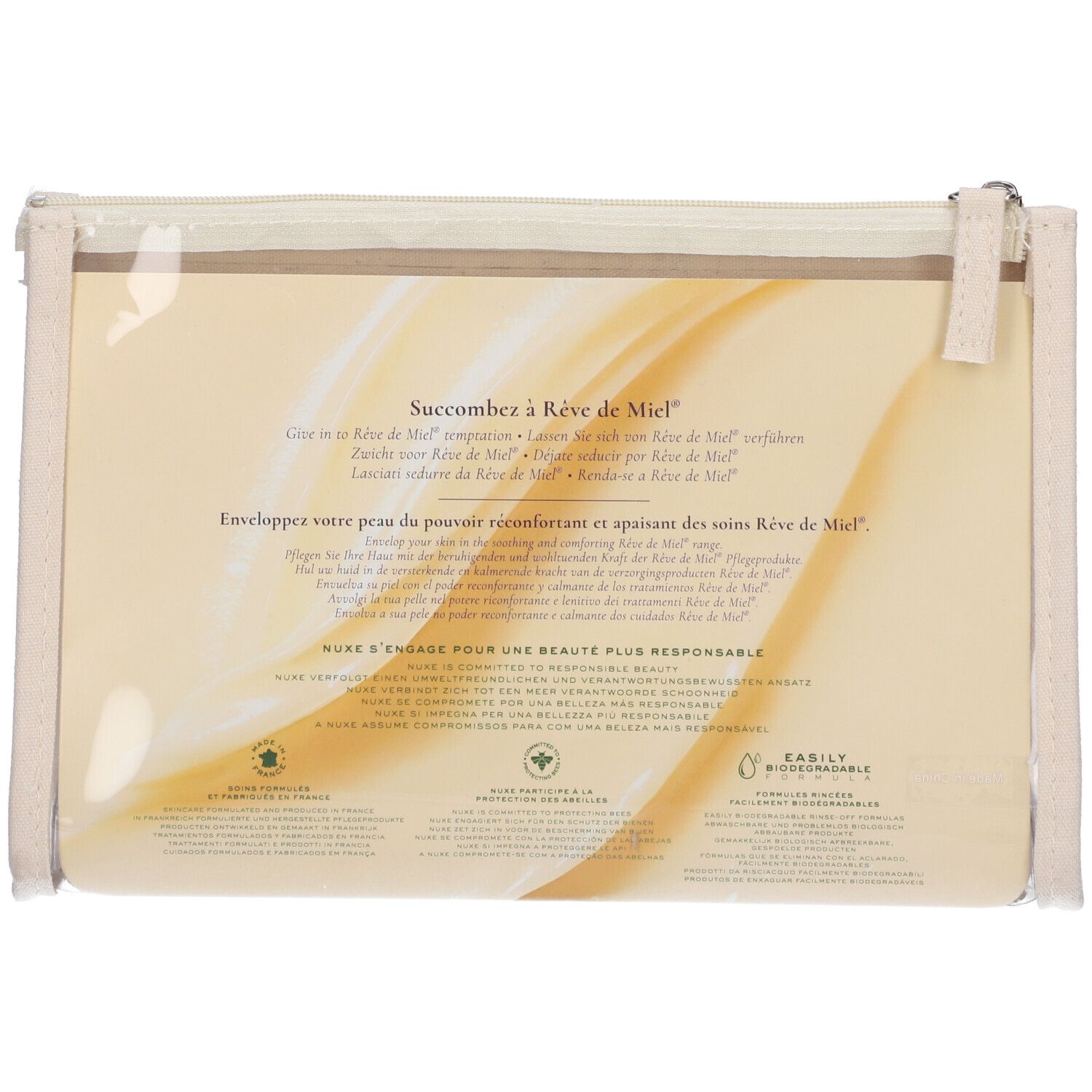 Retro della trousse trasparente con testo e logo. Informazioni sul prodotto e sul marchio NUXE.