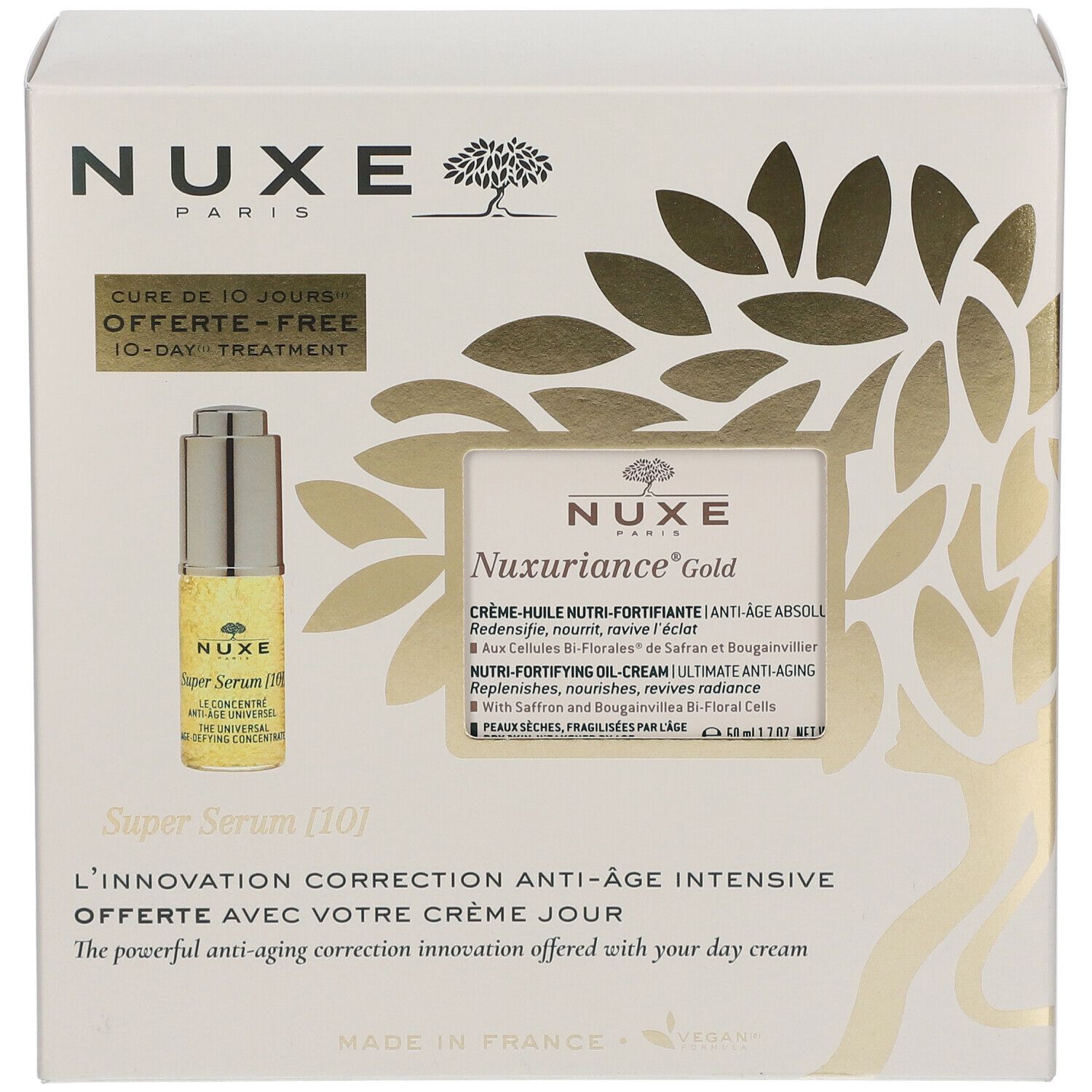 Scatola bianca con dettagli dorati. Contiene un flacone Super Serum [10] e un'immagine del prodotto. Testo: NUXE, Nuxuriance Gold.