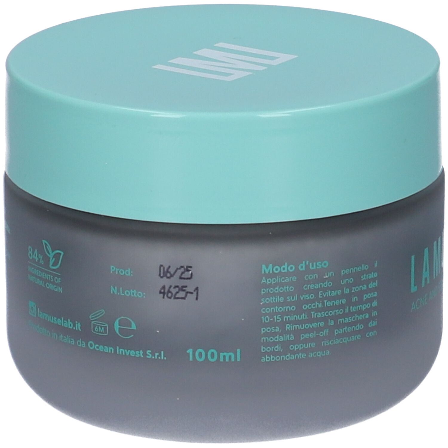 Vaso grigio scuro con coperchio turchese. Scritta LAMUSELAB. Testo: SEBONORM METAL MASK. Sul retro testo e 84% ingredienti di origine naturale.