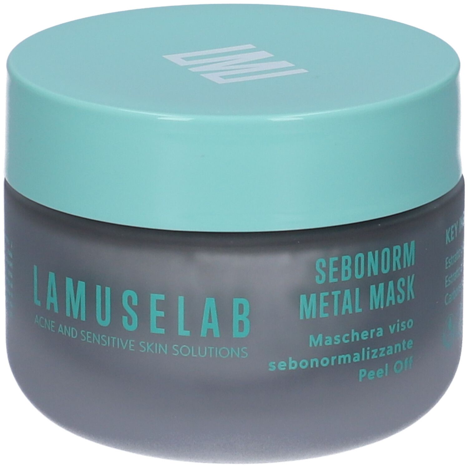 Vaso grigio scuro con coperchio turchese. Scritta LAMUSELAB. Testo: SEBONORM METAL MASK. Acne and Sensitive Skin Solutions.